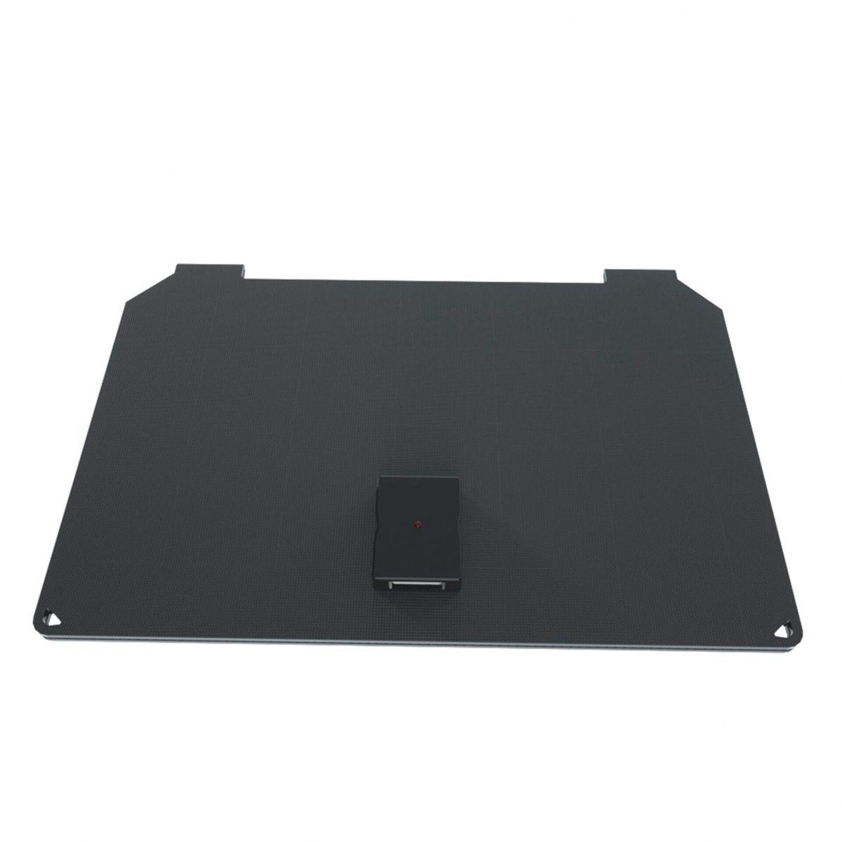 Una base rectangular negra con un pequeño componente negro encima.