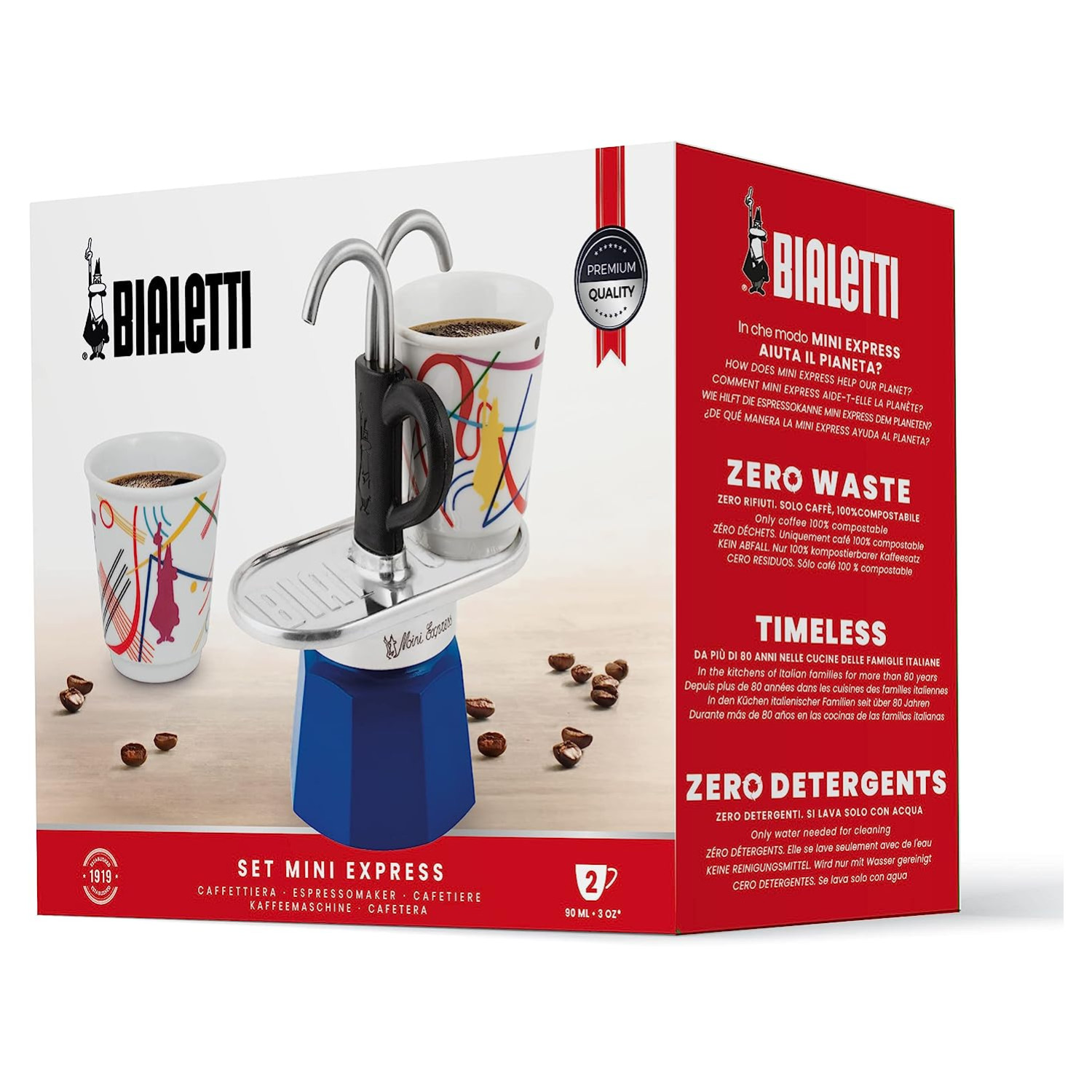 Zestaw Bialetti Mini Express z filiżankami i ziarnami kawy, na białym tle.