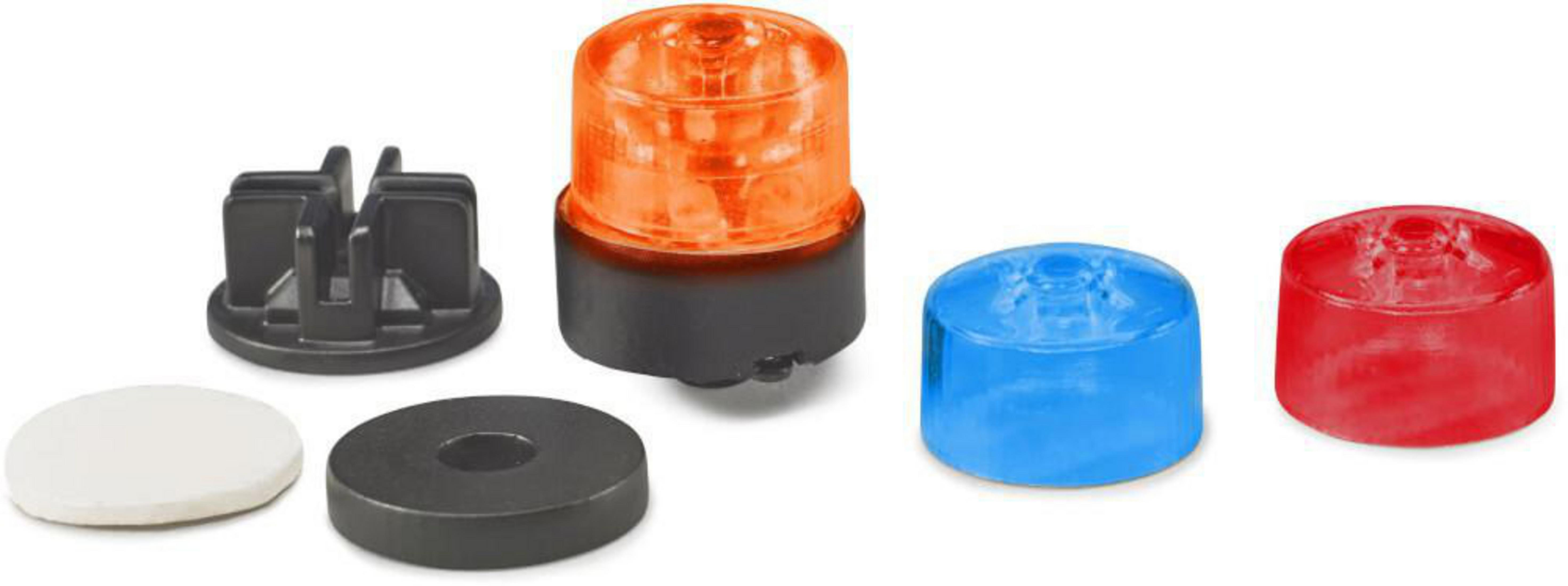 Orange, blaue und rote Lichter mit schwarzem Sockel und weißer Unterlage.