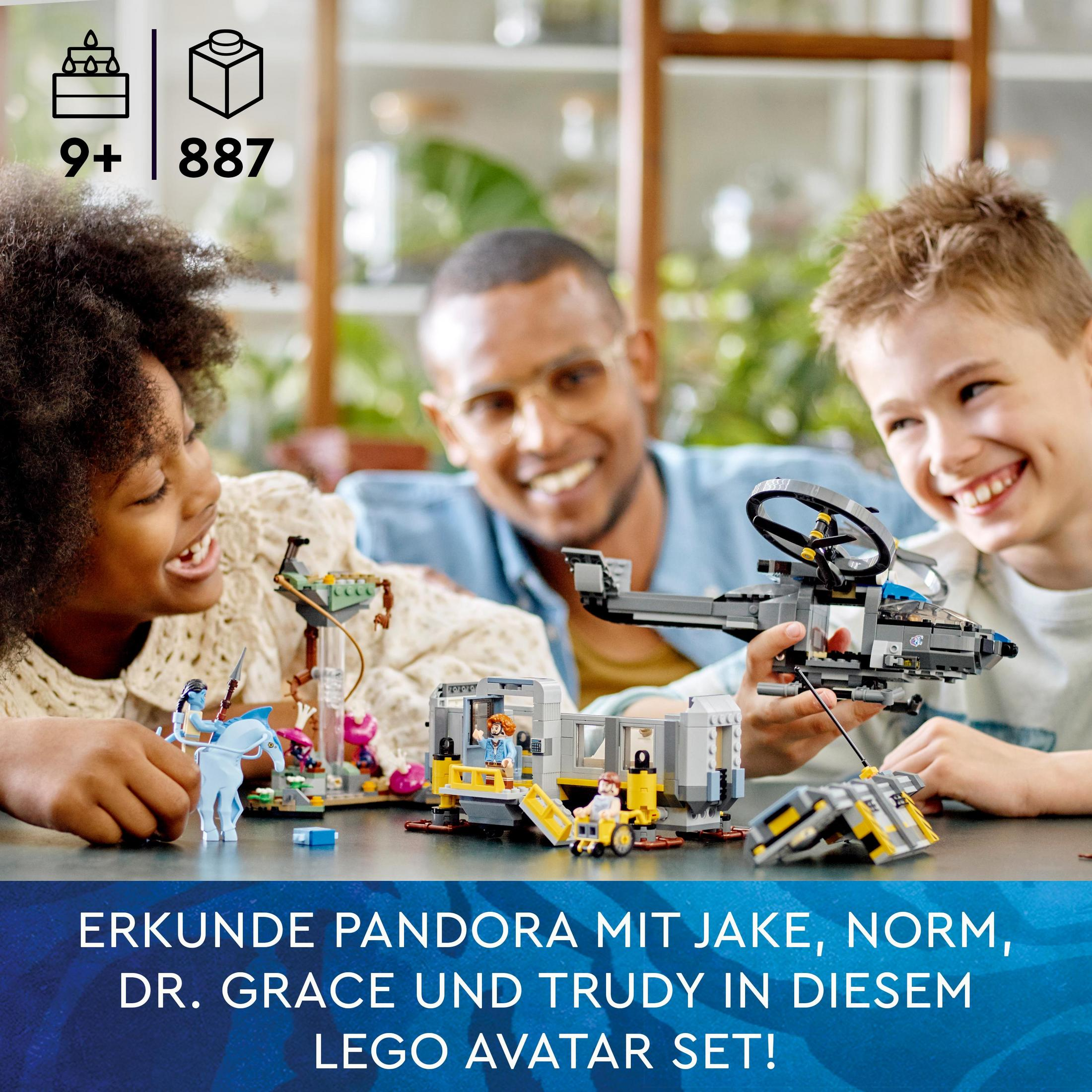 Dzieci bawią się zestawem Lego Avatar. Mężczyzna patrzy. Zestaw zawiera pojazd i budynek.