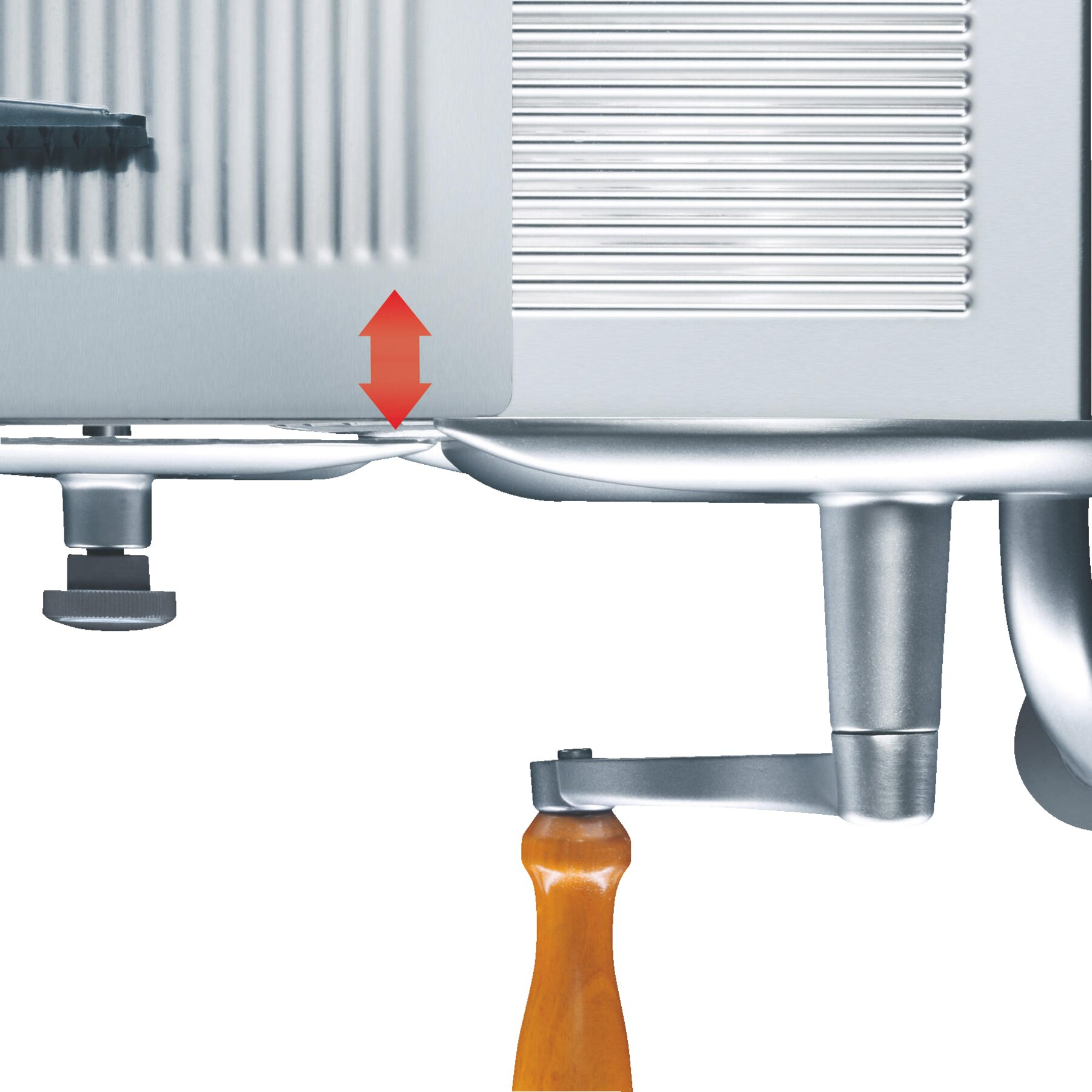 Zbliżenie metalowej krajalnicy ze strzałką wskazującą regulowaną odległość ostrza.