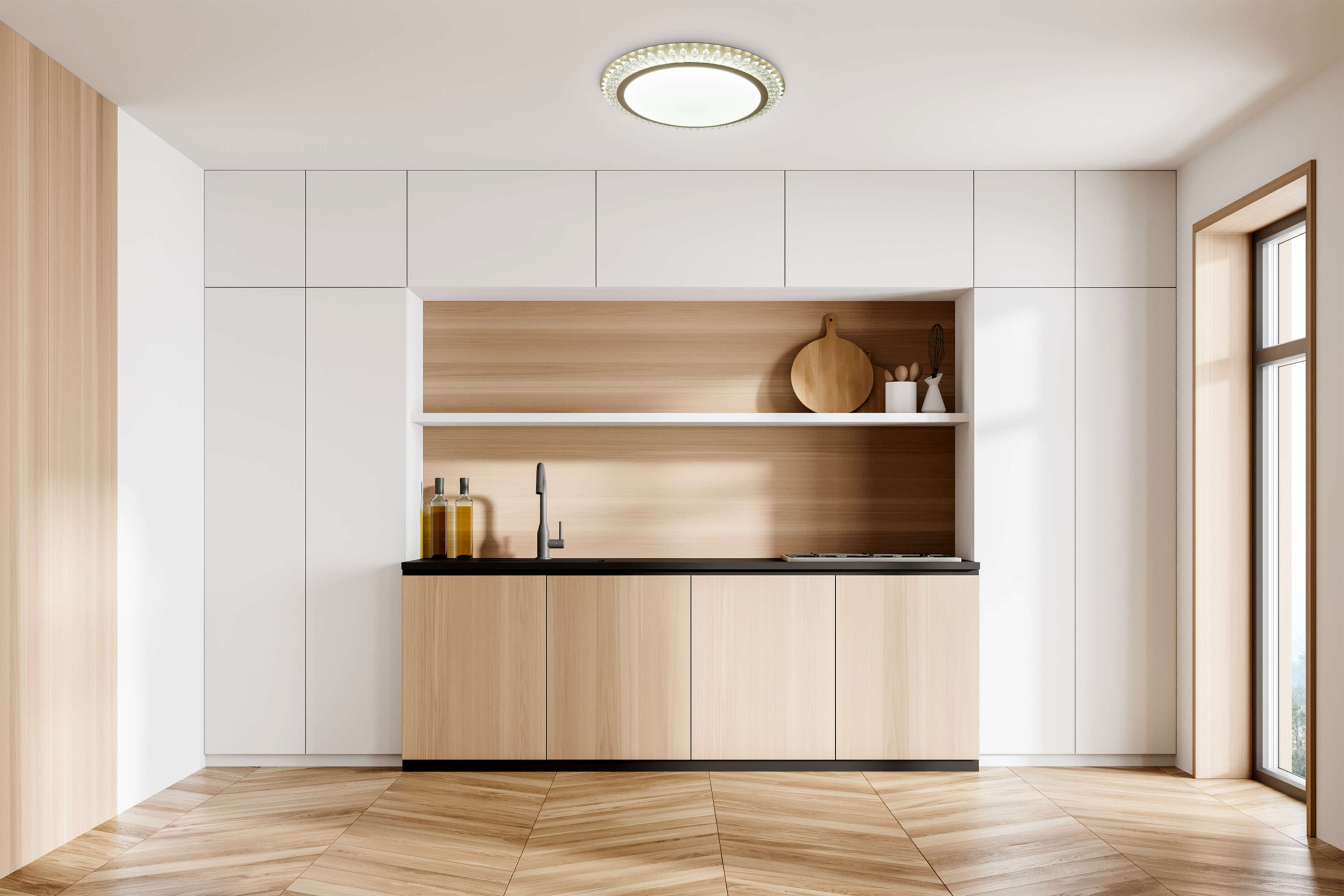 Modernes Kücheninterieur mit Holzschränken und weißen Wänden. Eine runde Deckenleuchte ist vorhanden.