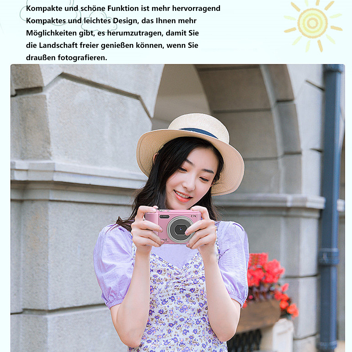 Mujer tomando fotos con una cámara rosa. Lleva sombrero y vestido floral. Soleado al aire libre.