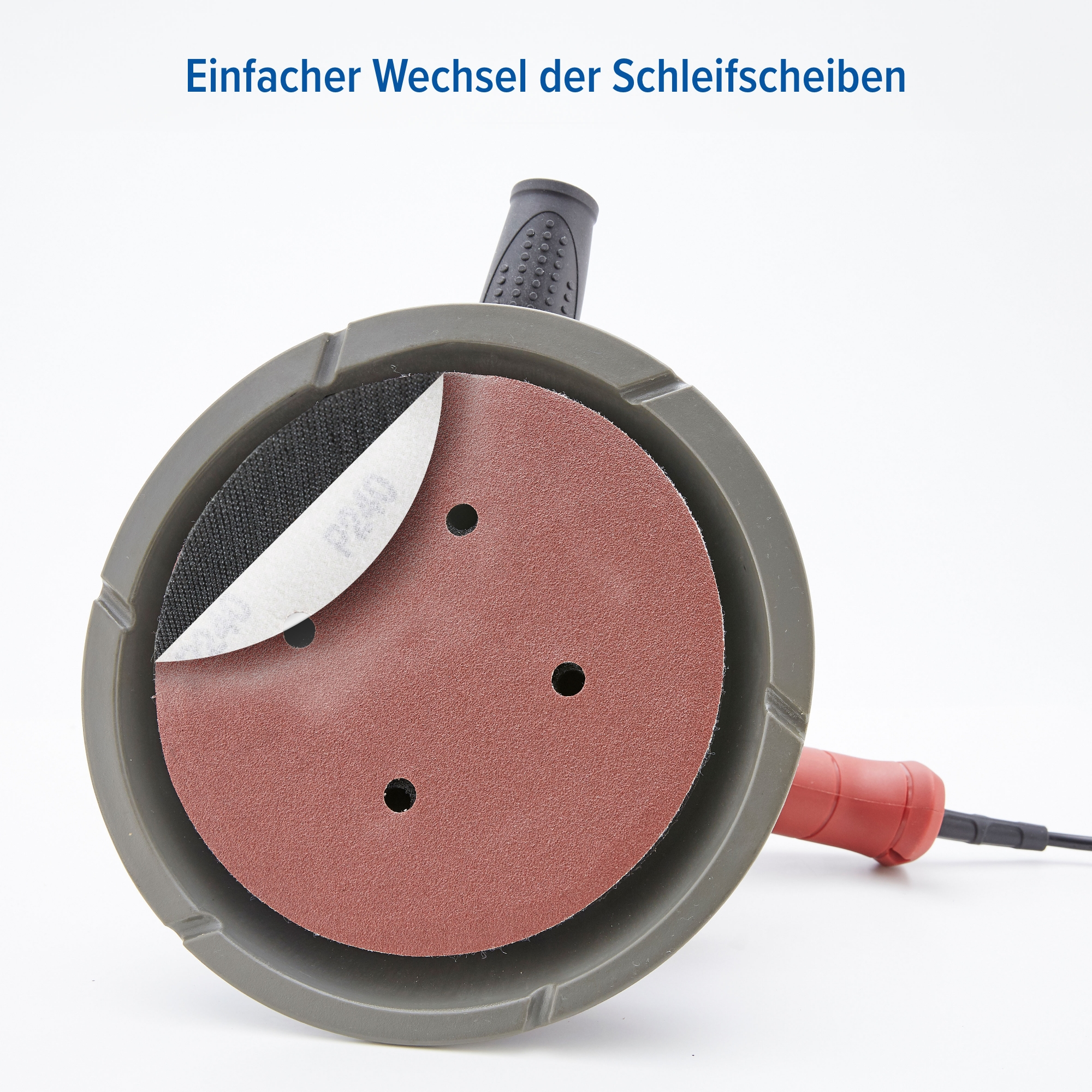 Schleifer mit rotem Griff und grauem Sockel. Eine Schleifscheibe ist teilweise entfernt, eine andere zeigend.