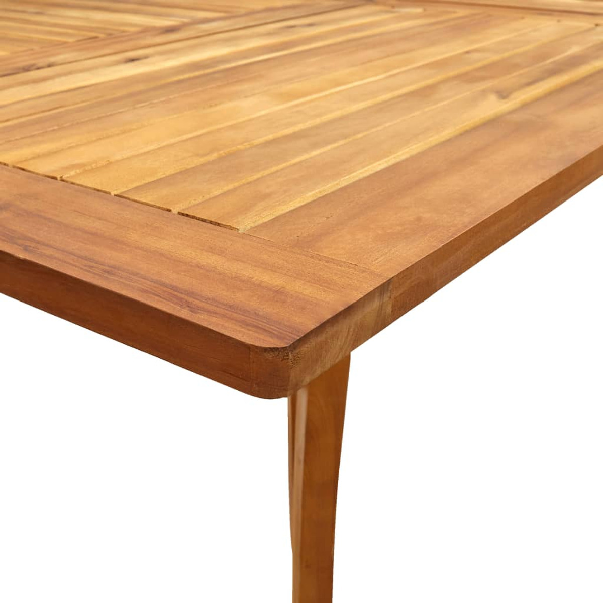 Ecke eines Holztisches. Der Tisch ist hellbraun und rechteckig.