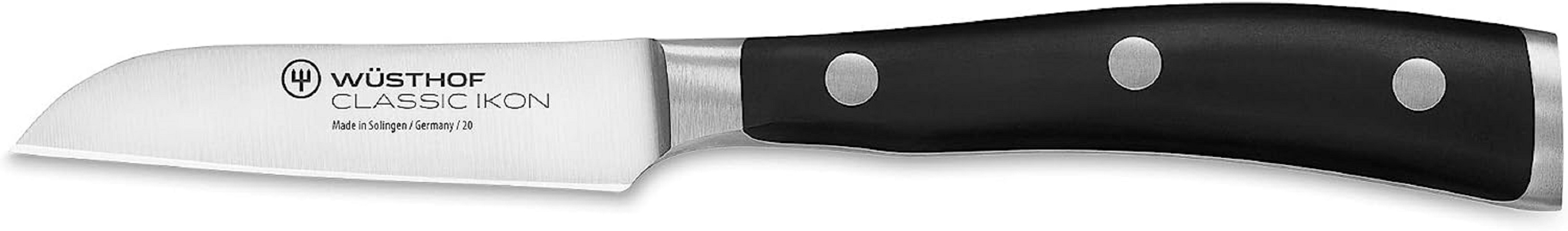 Ein Edelstahlmesser mit schwarzem Griff, mit dem Markennamen WÜSTHOF auf der Klinge.