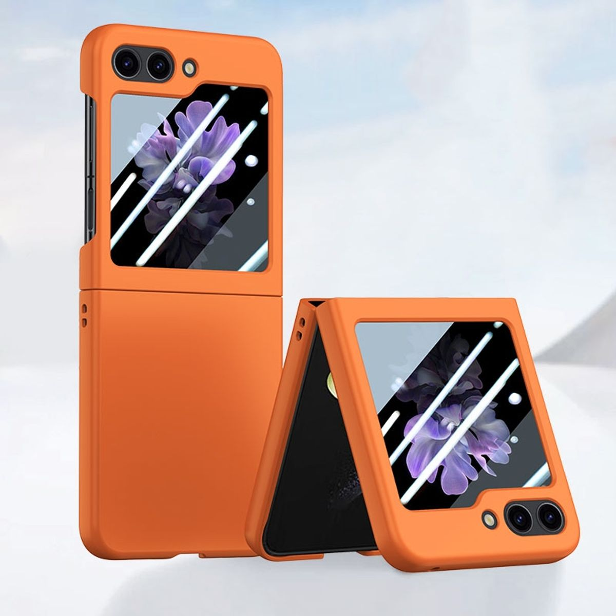 Orangene faltbare Handyhülle, mit zwei geöffneten Telefonen.