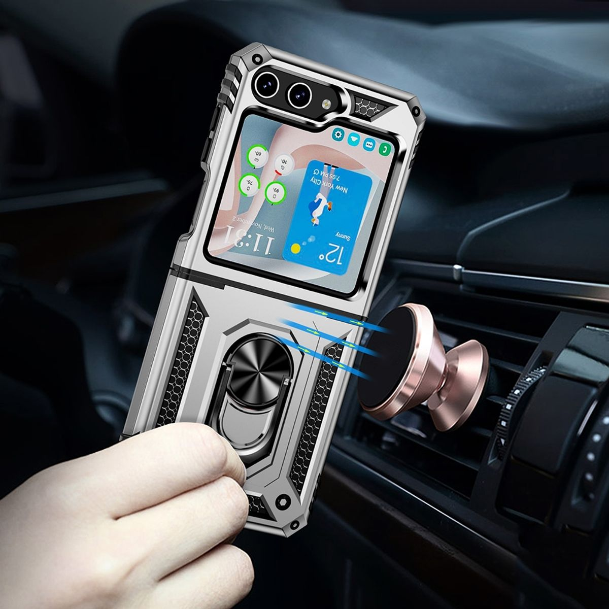Eine silberne Handyhülle mit Telefon ist an einer Lüftung im Auto befestigt.