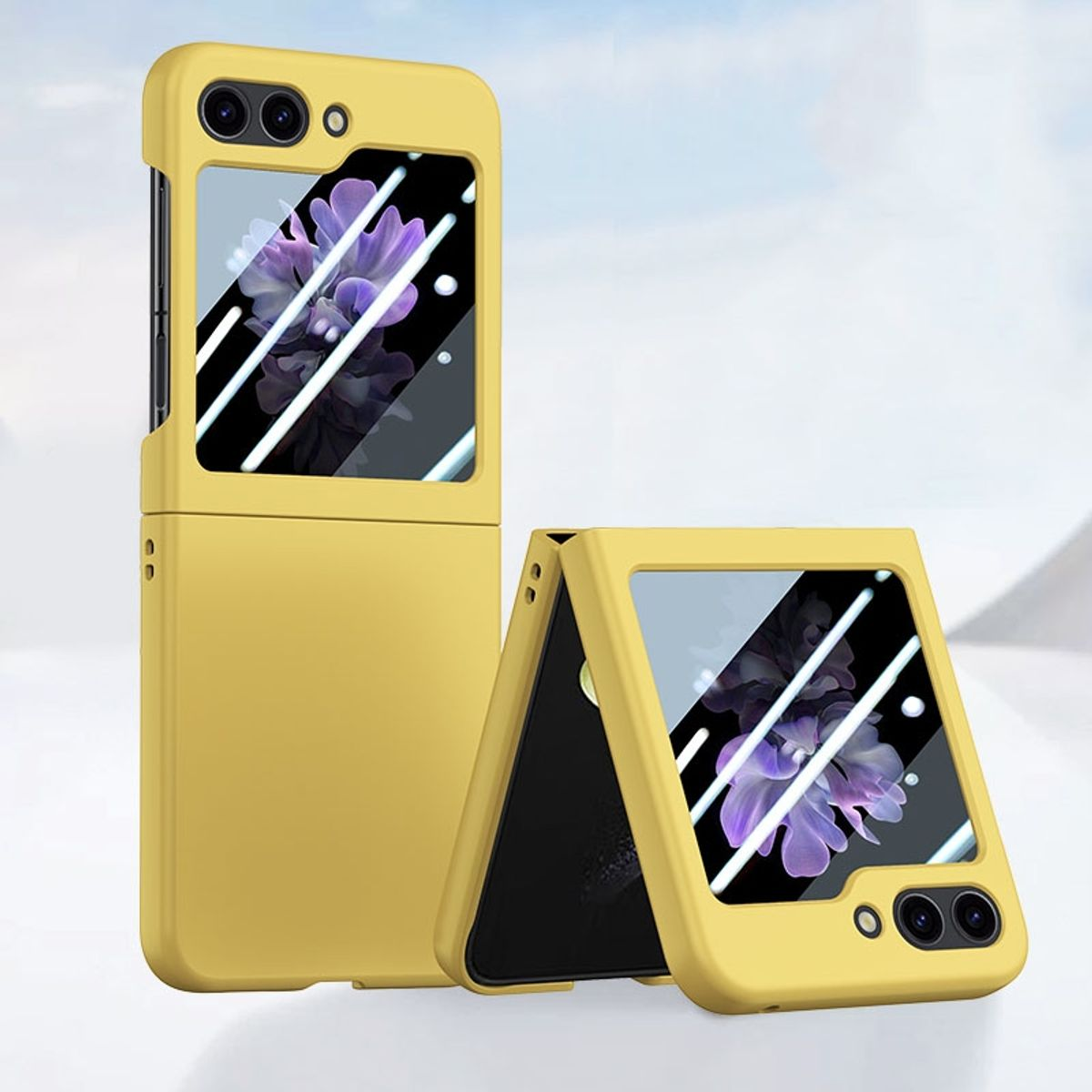 Ein gelbes faltbares Telefon. Der Bildschirm zeigt eine lila Blume. Der Hintergrund ist verschwommen.