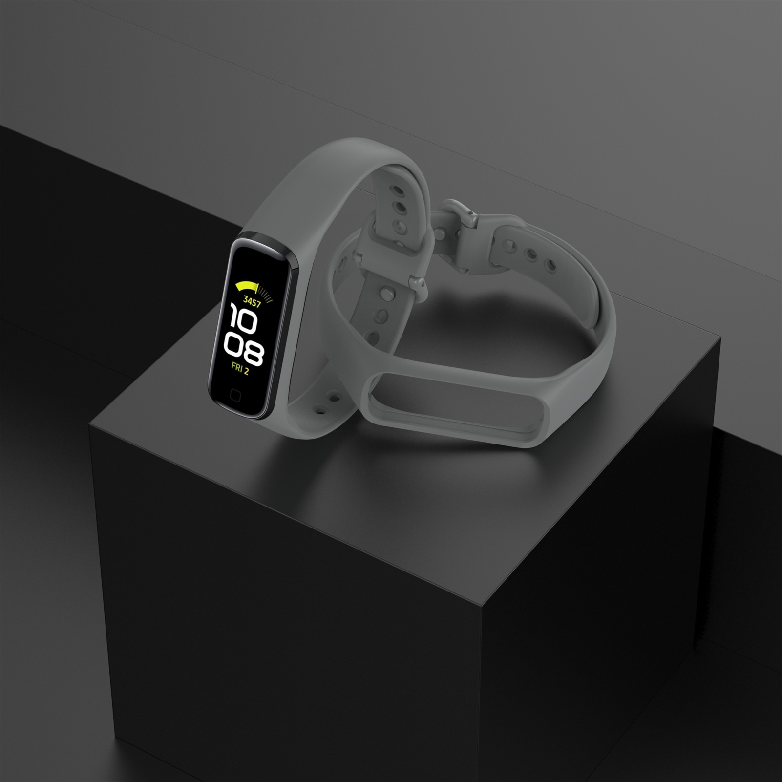 Szary smartwatch z paskiem. Zegarek wyświetla godzinę. Tło jest ciemne.