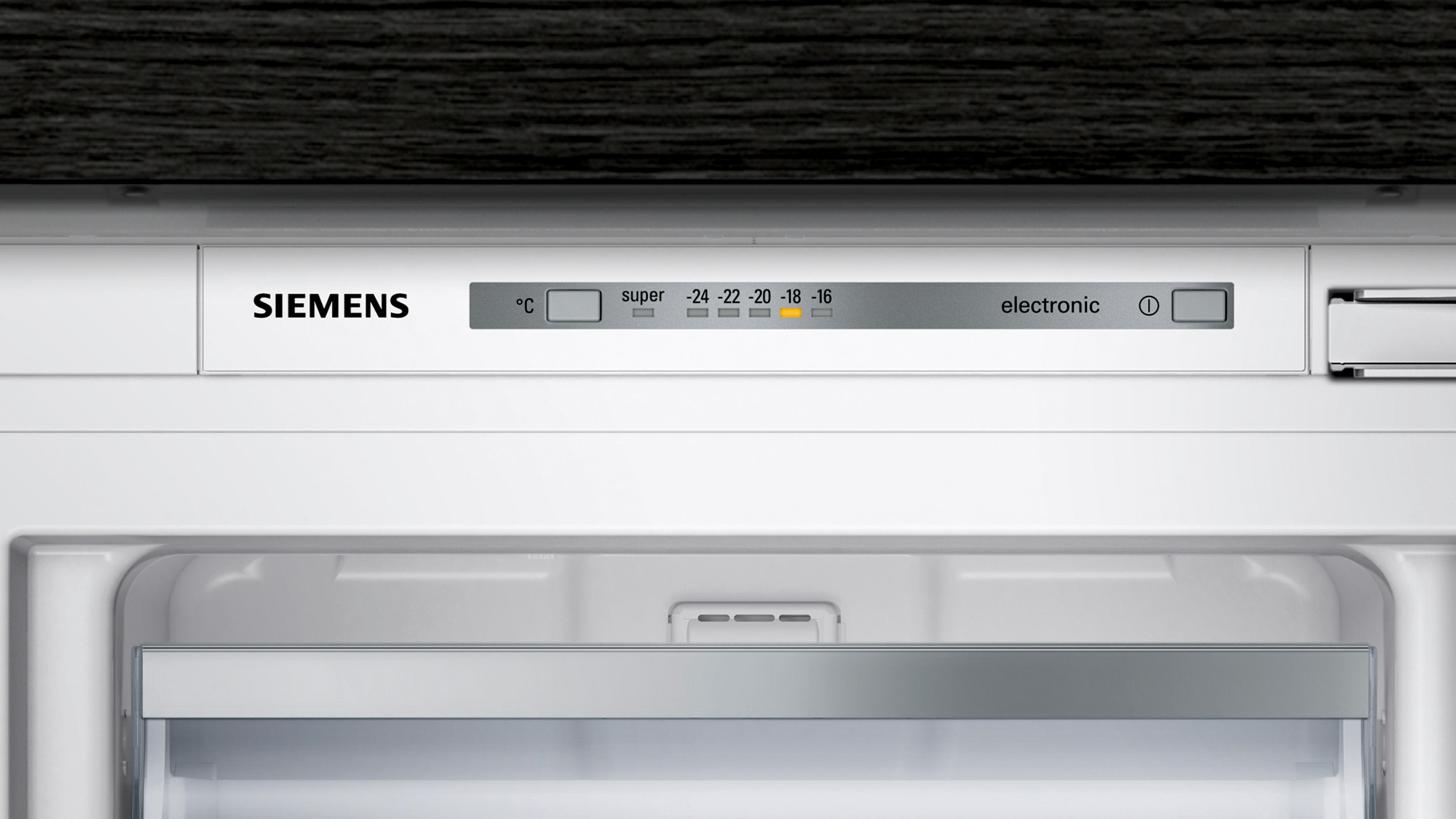 Close-up of a refrigerator control panel. It shows temperature settings and the Siemens logo.