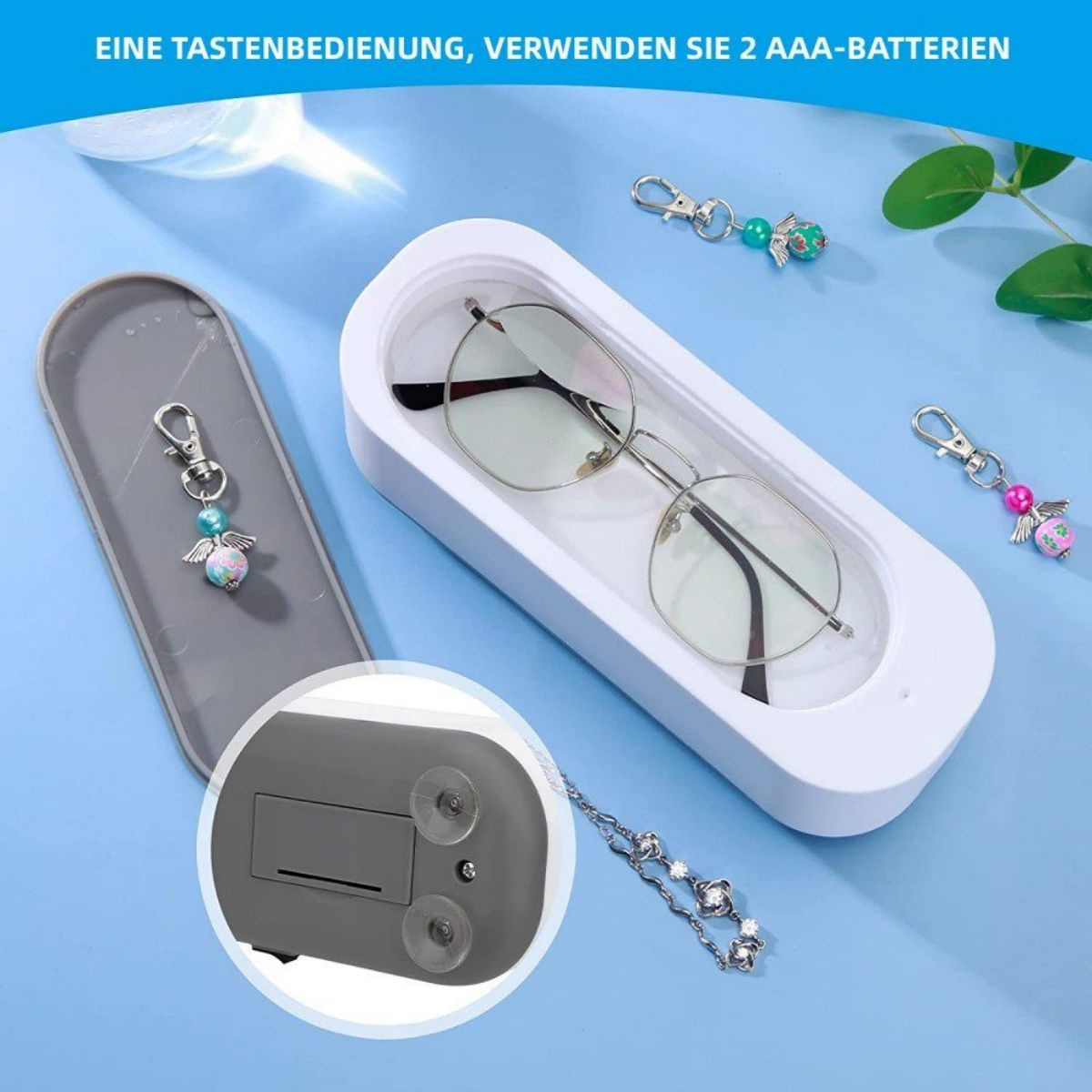 Ein Ultraschallreiniger mit Brille und Charms, mit Zubehör.
