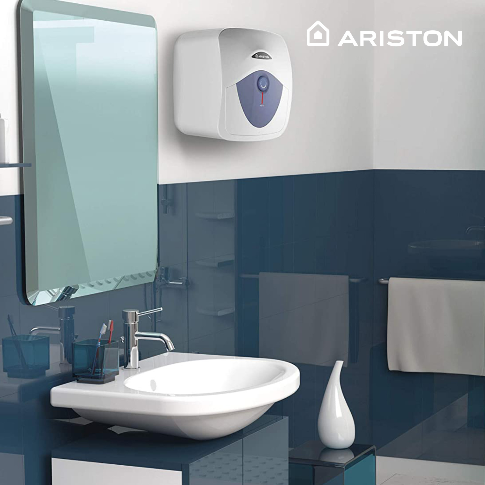 Escena de baño con lavabo, espejo y calentador de agua. El calentador es ARISTON.