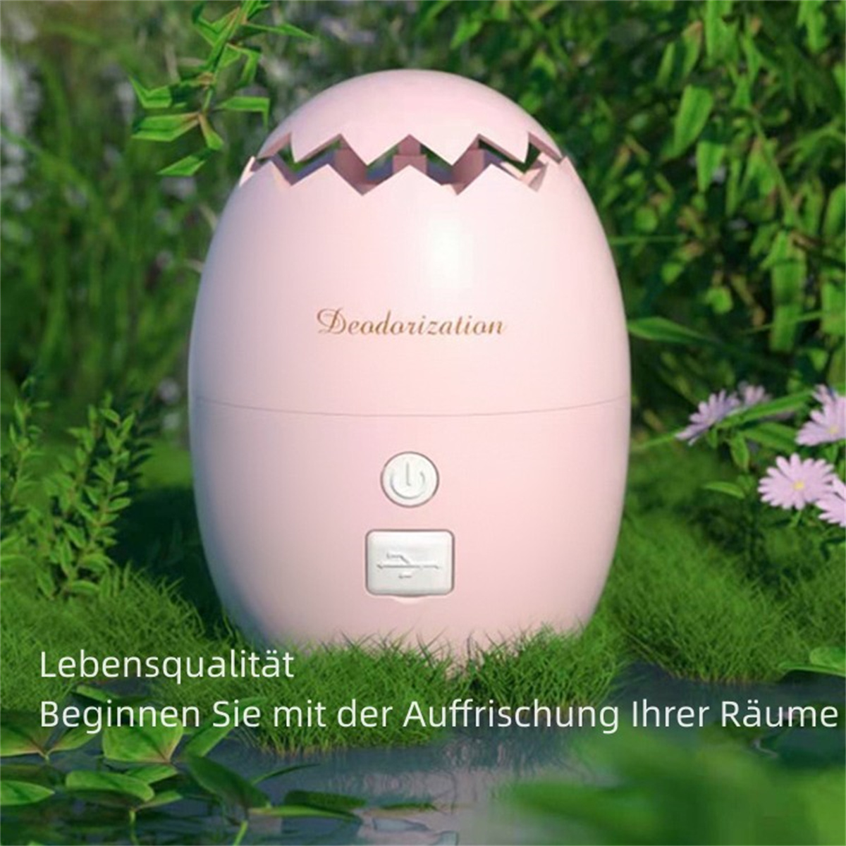Rosa eiförmiger Lufterfrischer mit Design und Text auf Deutsch, vor grünem Gras und Laub.
