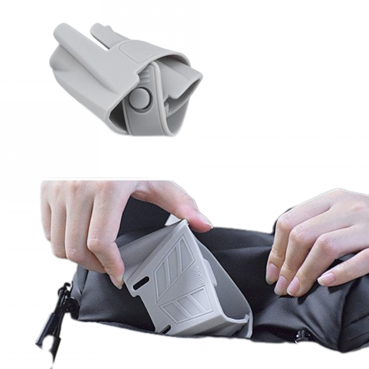 Hände legen graues Objekt in schwarze Tasche, Draufsicht.