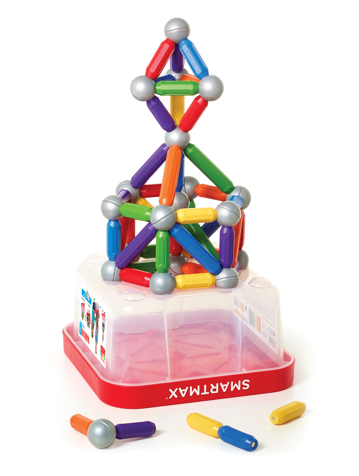 Kolorowe magnetyczne klocki tworzące wieżę, w czerwonym pojemniku z tekstem.