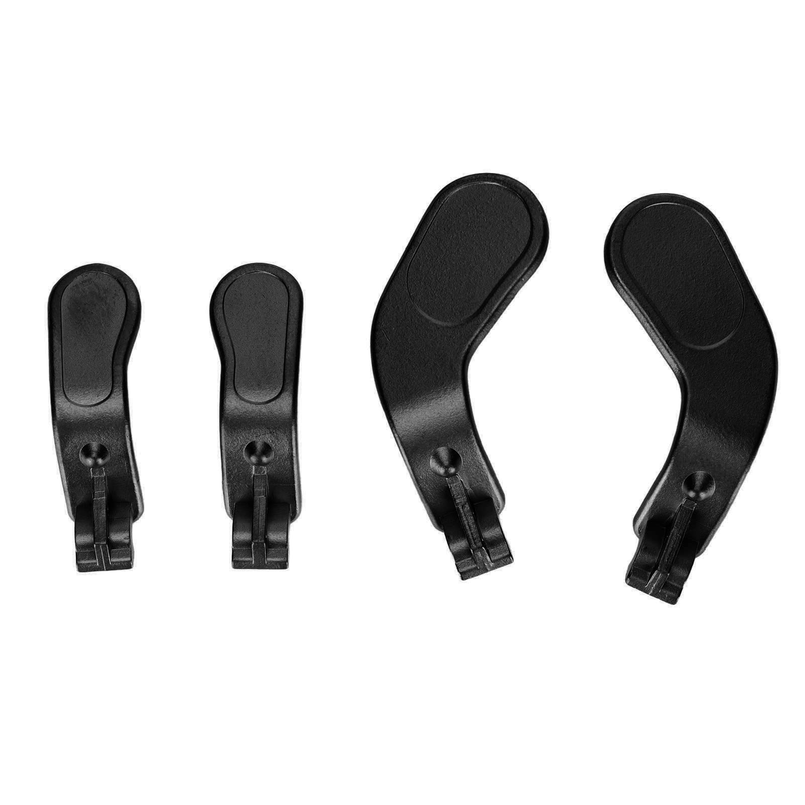 Ein Satz schwarzer Controller-Tasten, verschiedene Größen und Formen, vor weißem Hintergrund.