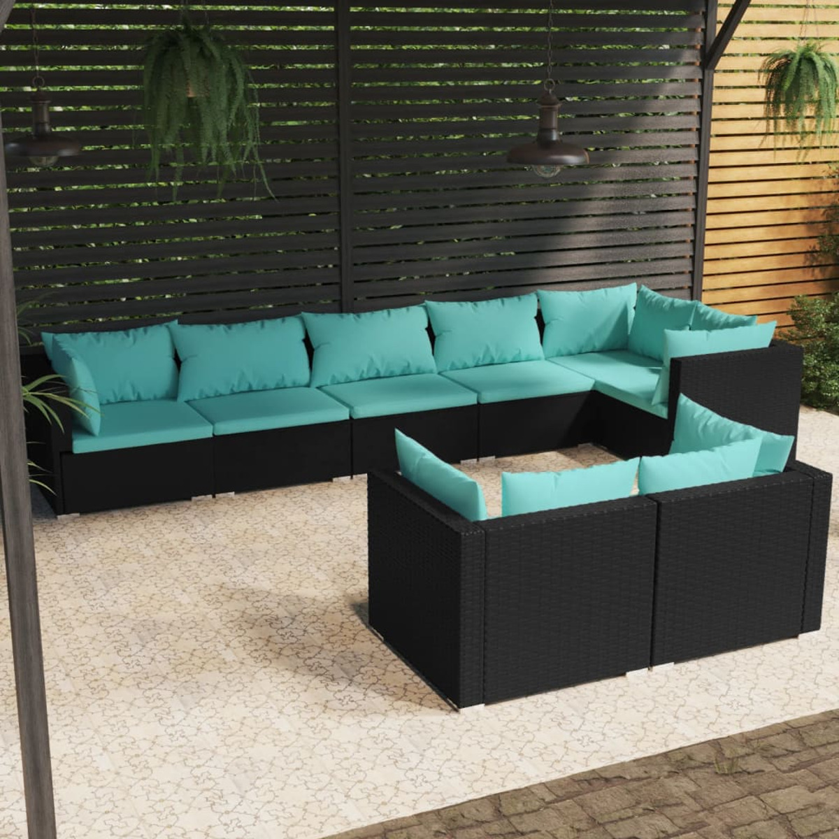 Schwarzes Ecksofa für den Außenbereich mit türkisfarbenen Kissen auf einer Steinterrasse.