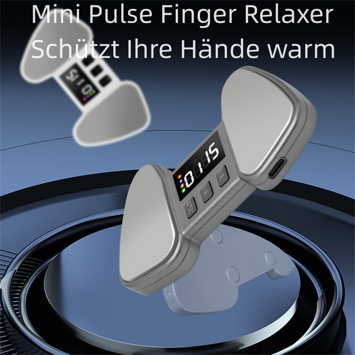 Ein Entspannungsgerät. Es ist silbern und hat ein Display mit Knöpfen. Der Text lautet: "Mini Pulse Finger Relaxer".
