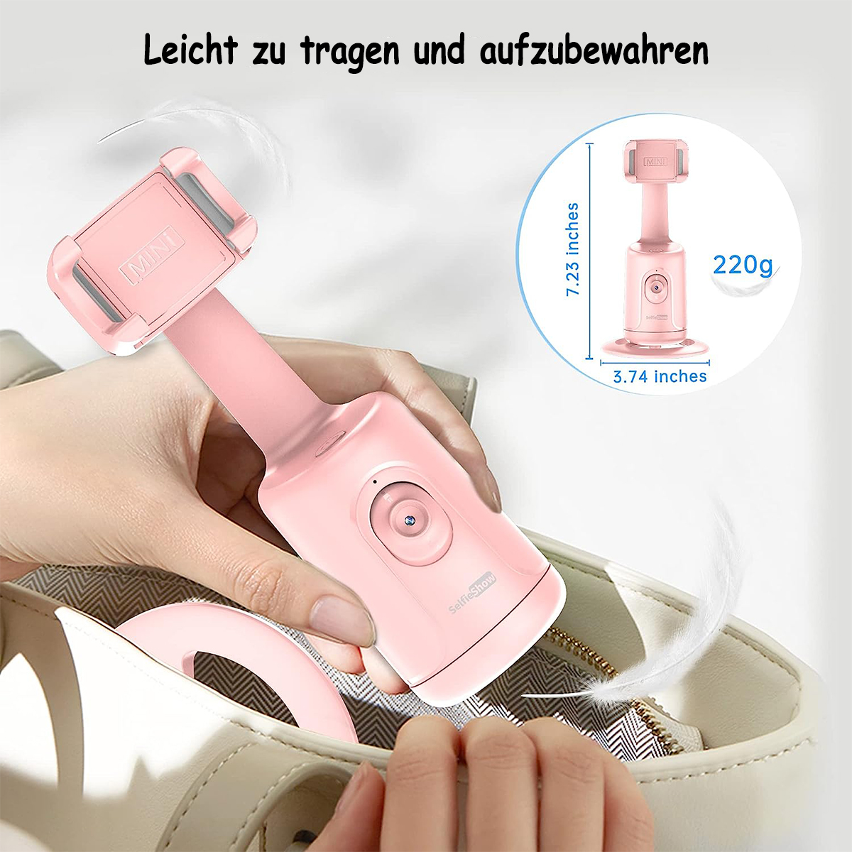 Eine Hand hält einen rosa faltbaren Telefonhalter; im Hintergrund ist eine kleine, weiße Tasche zu sehen.