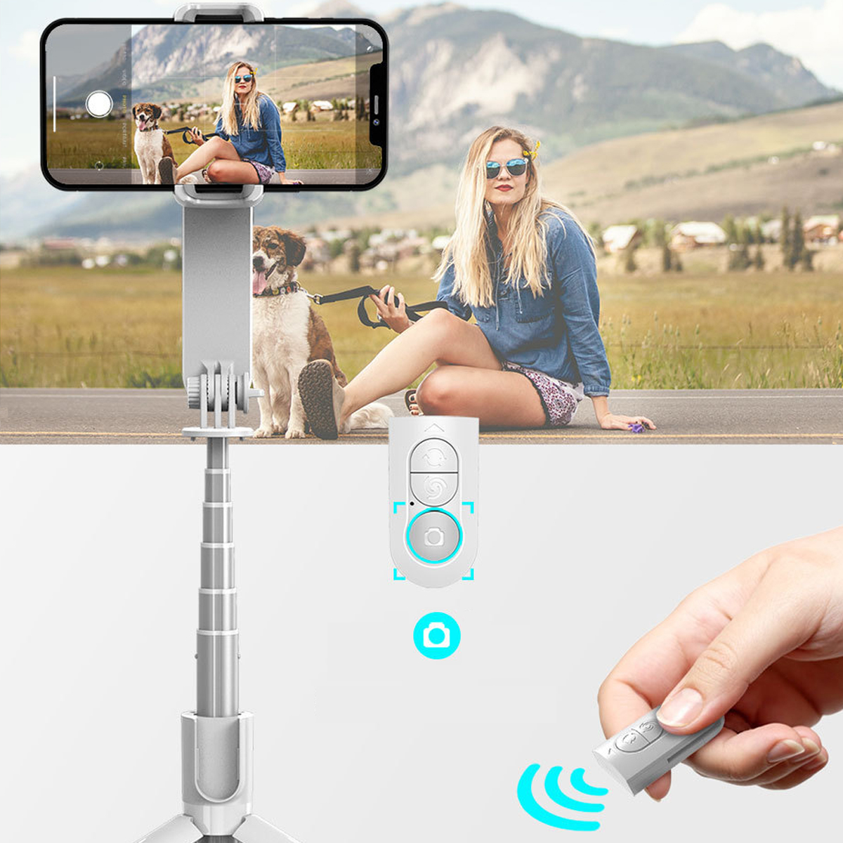 Frau mit Hund macht Foto mit Smartphone auf Selfie-Stick. Fernbedienung sichtbar.