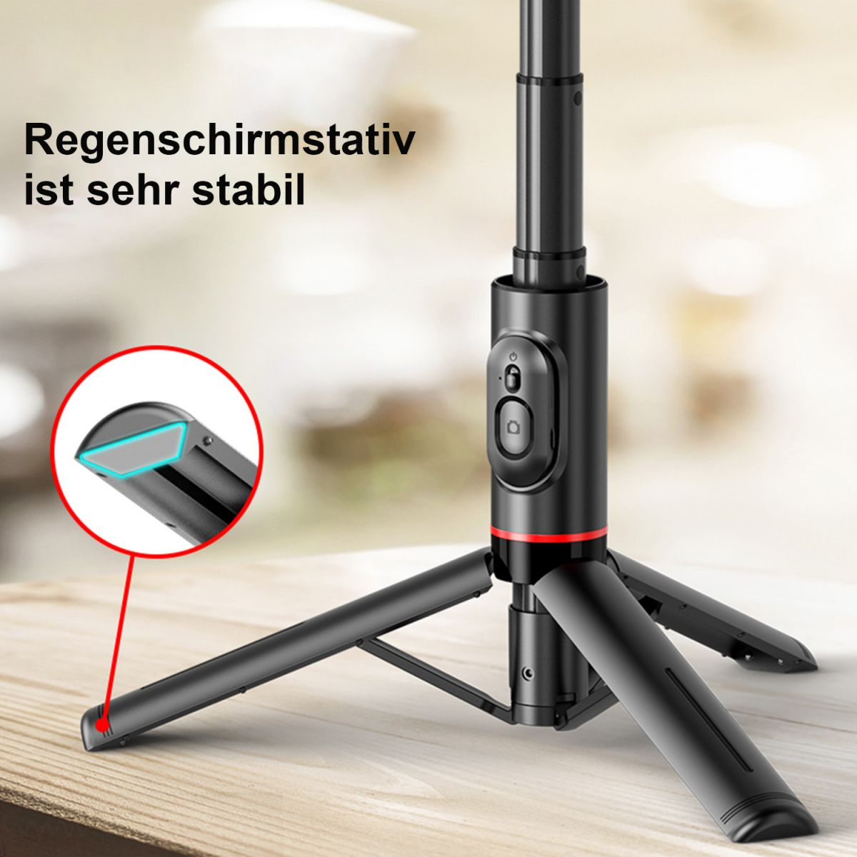 Schwarzes Stativ mit roten Akzenten und drei ausgeklappten Beinen.