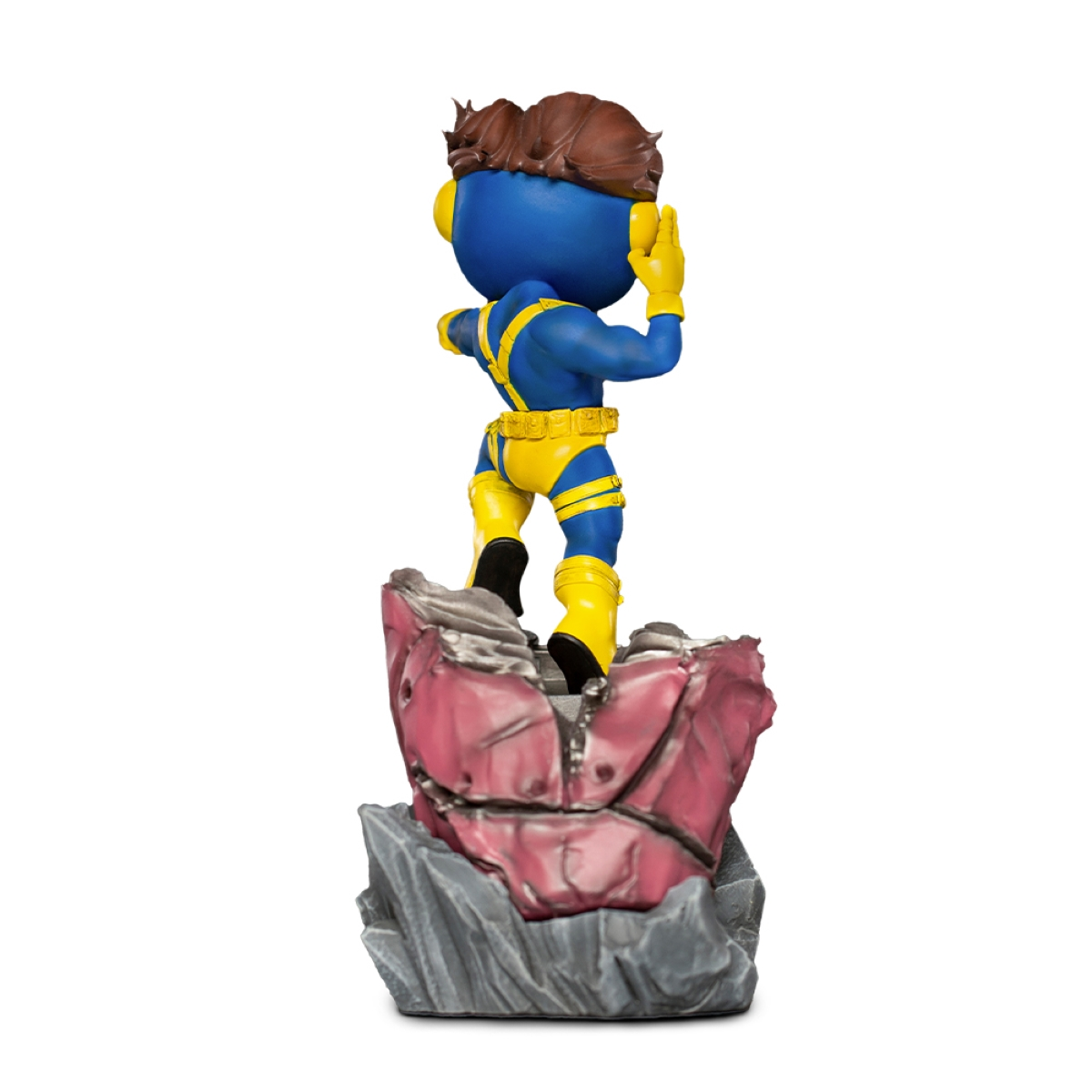 Eine blaue Comicfigur in einem gelb-blauen Outfit, die auf einem Felsen steht.