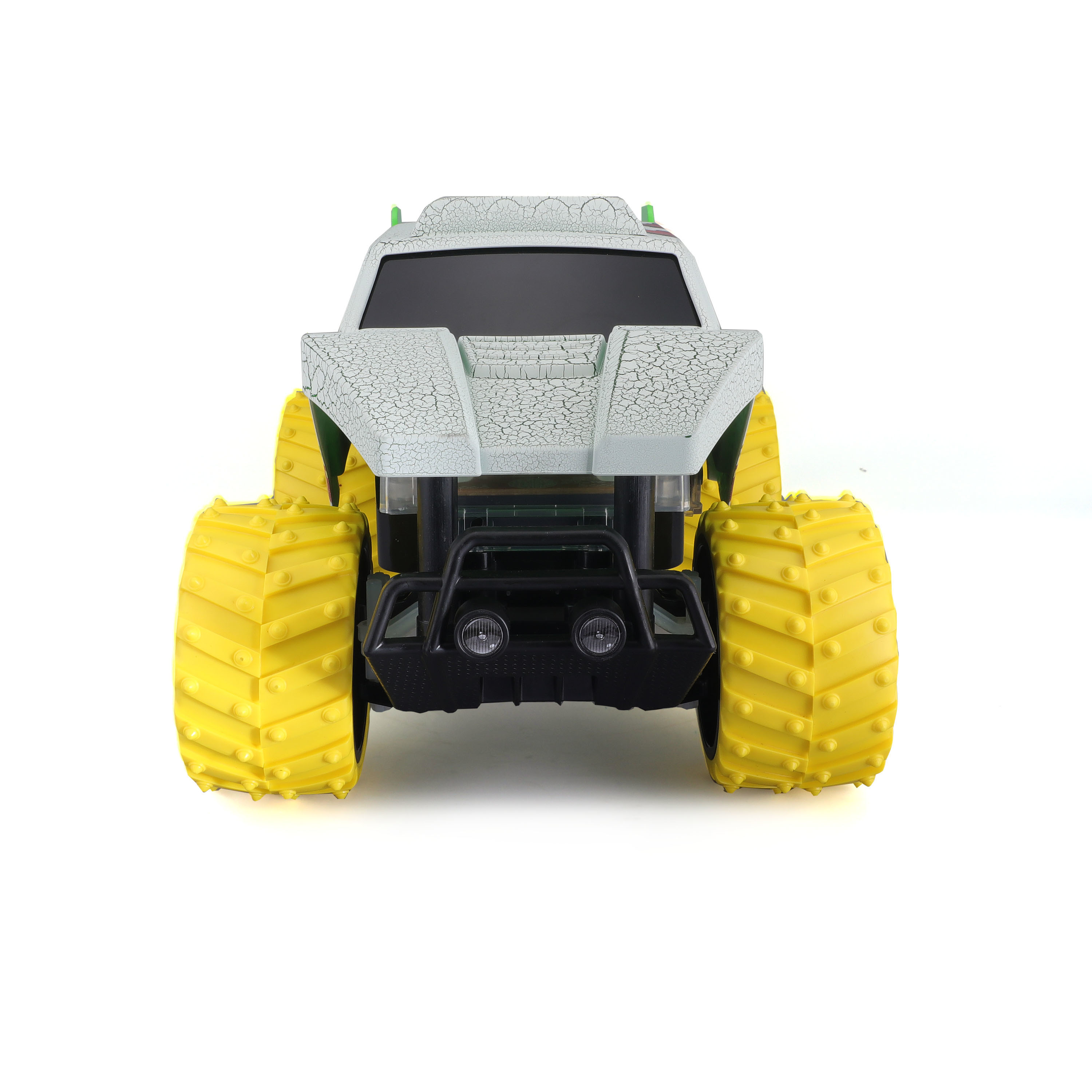 Spielzeug-Monstertruck mit gelben Reifen und einem rissigen weißen Körper. Der Truck schaut nach vorne.