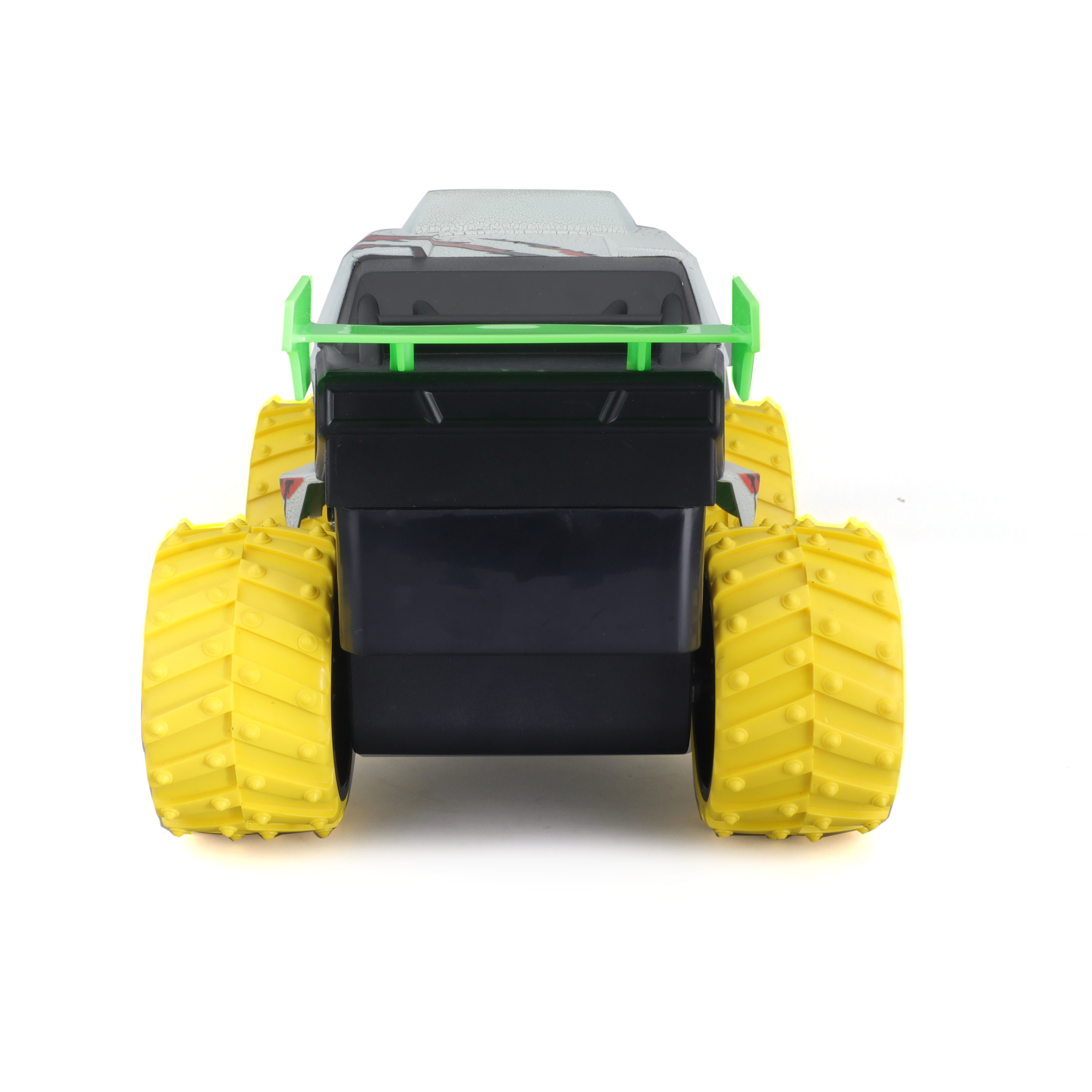 Monster-Truck-Spielzeug. Gelbe Reifen, grüner Spoiler. Schwarzer Körper, weißer Hintergrund.
