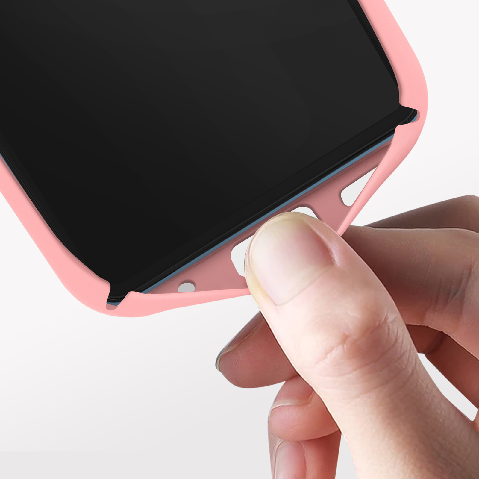 Hand hält eine pinkfarbene Handyhülle, Nahaufnahme.