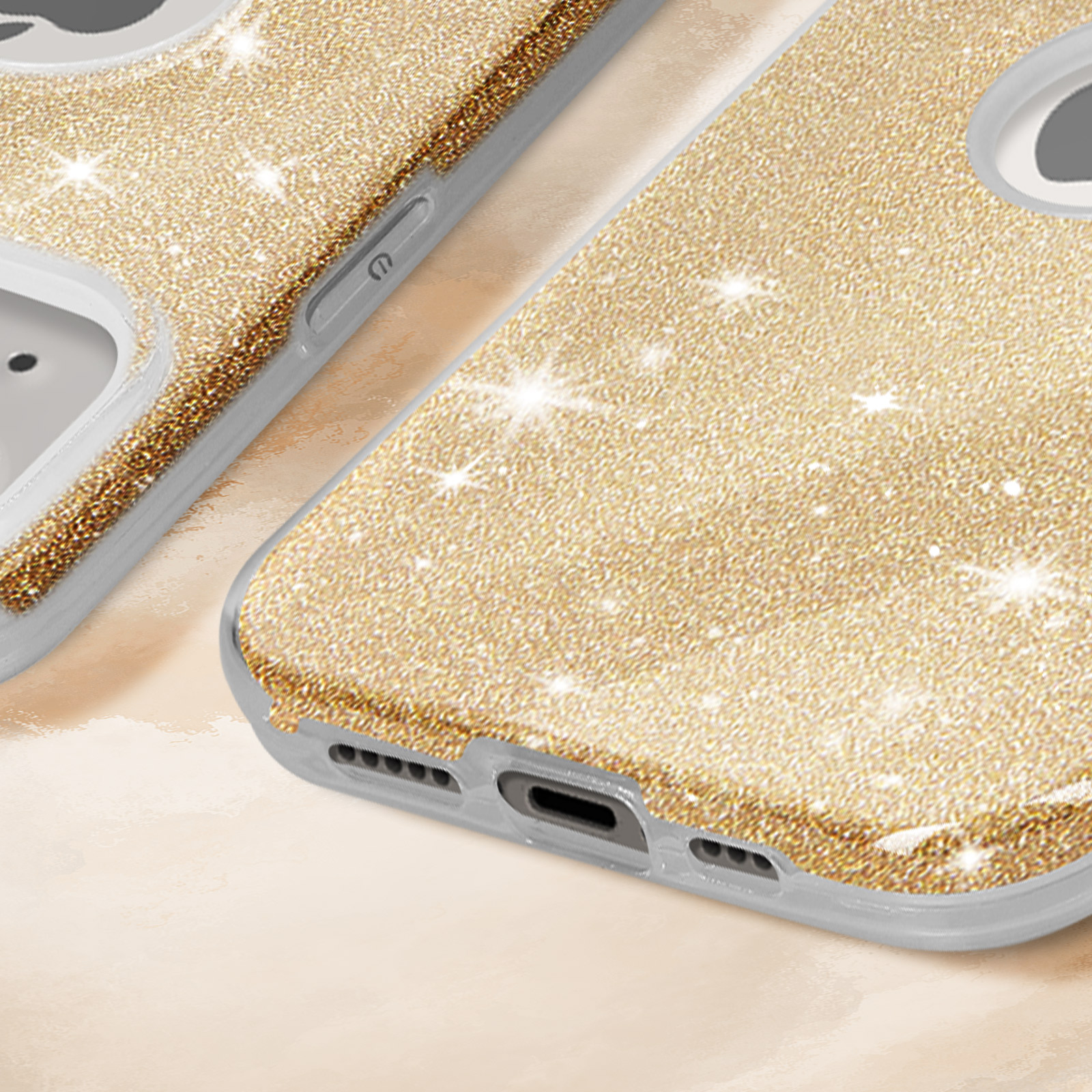 Nahaufnahme einer Handyhülle mit Glitzer. Goldene Farbe. Weißer Hintergrund.