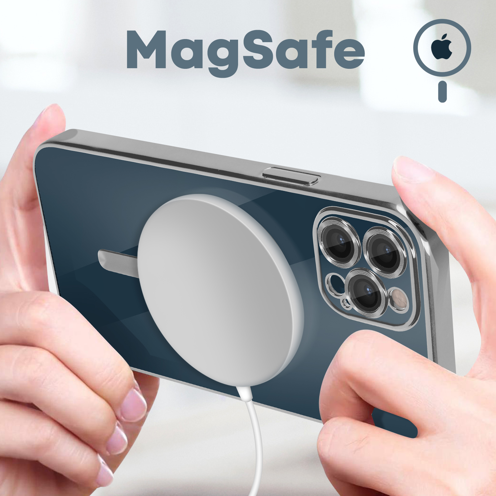 Mani che tengono un telefono con un caricatore MagSafe bianco collegato.