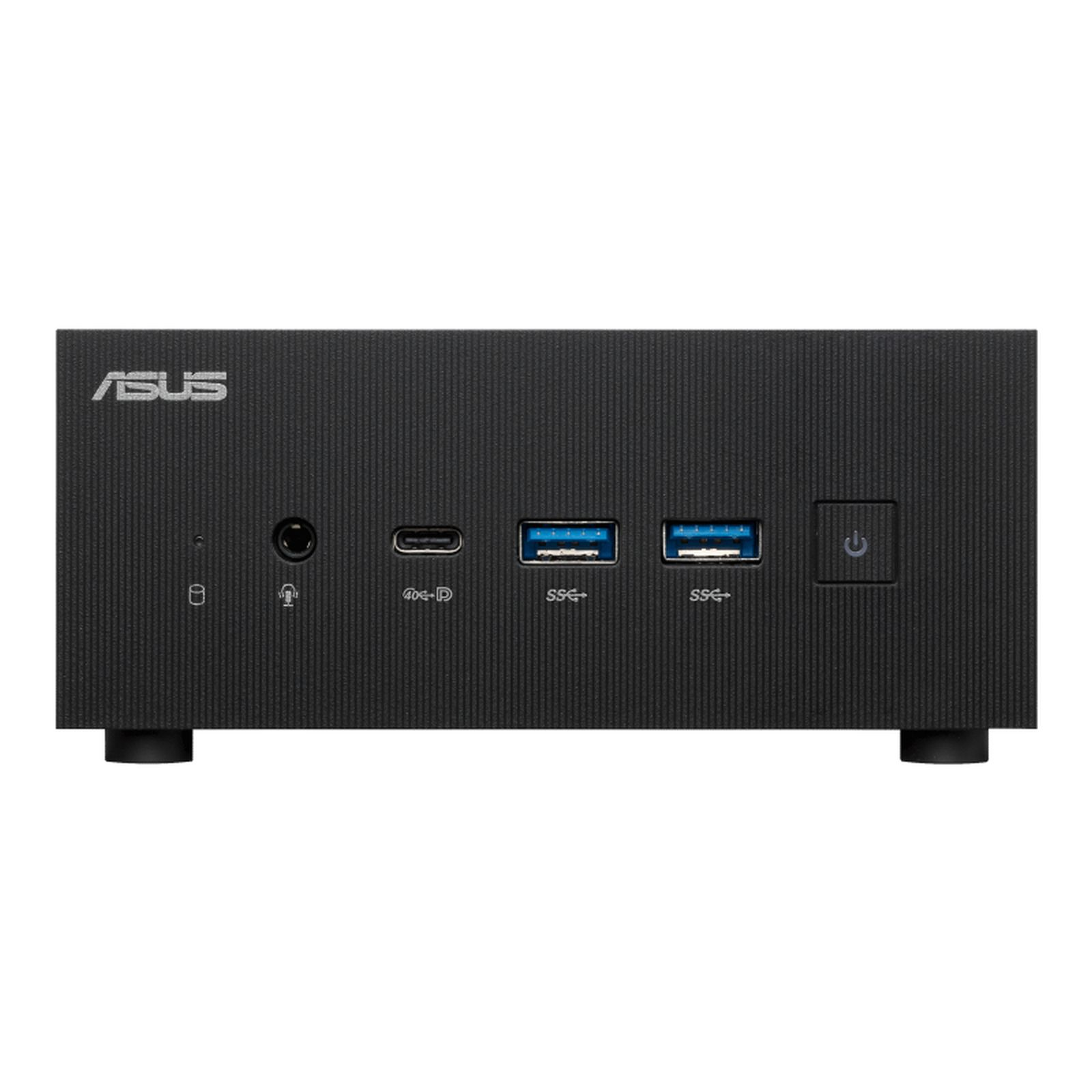 Czarny komputer ASUS. Posiada porty USB i przycisk zasilania. Tło jest białe.