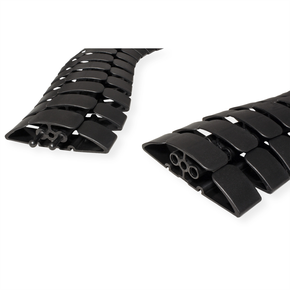 Black plastic cable organizers in a wavy pattern. They have multiple segments and holes.