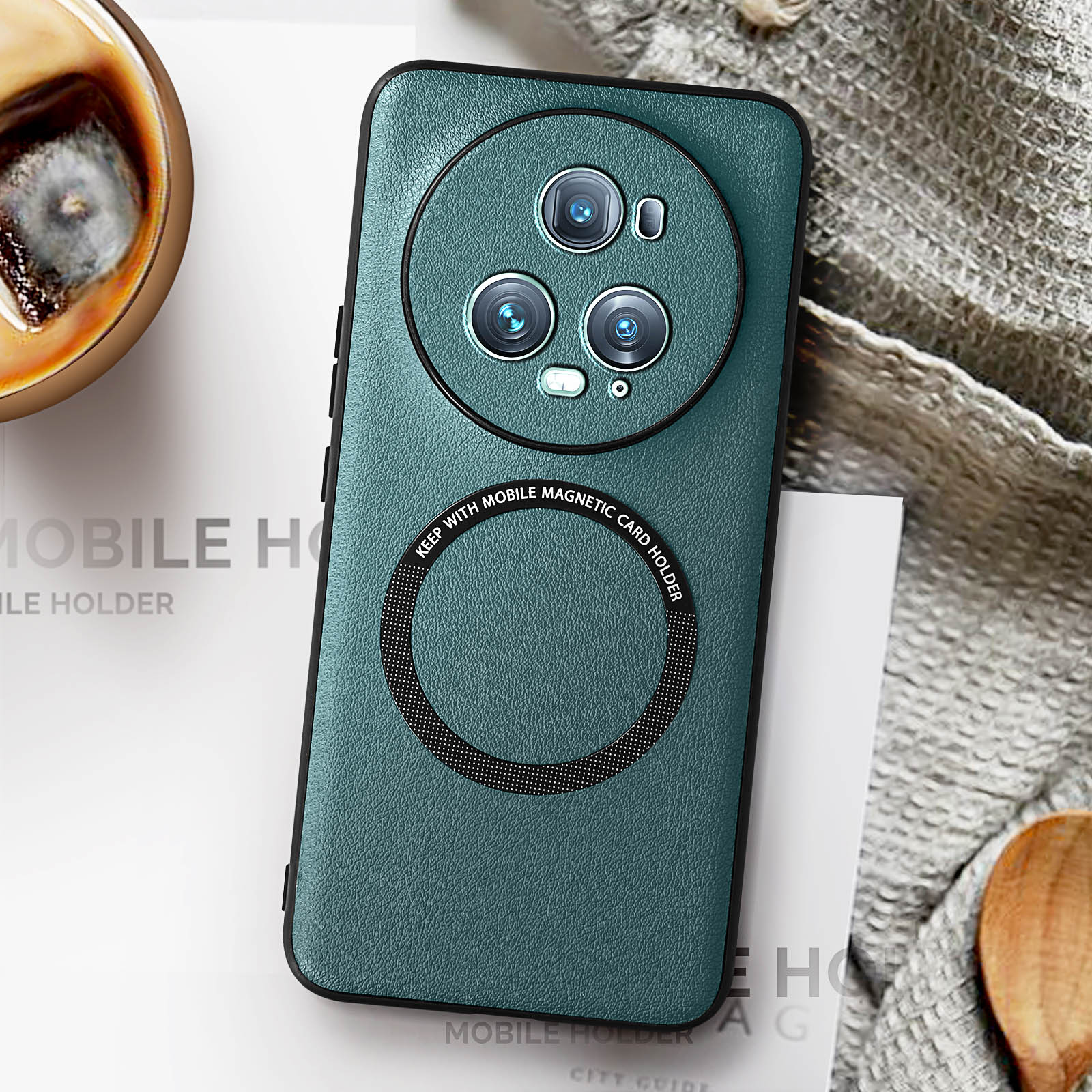 Teal phone case with circular camera design on a light fabric.