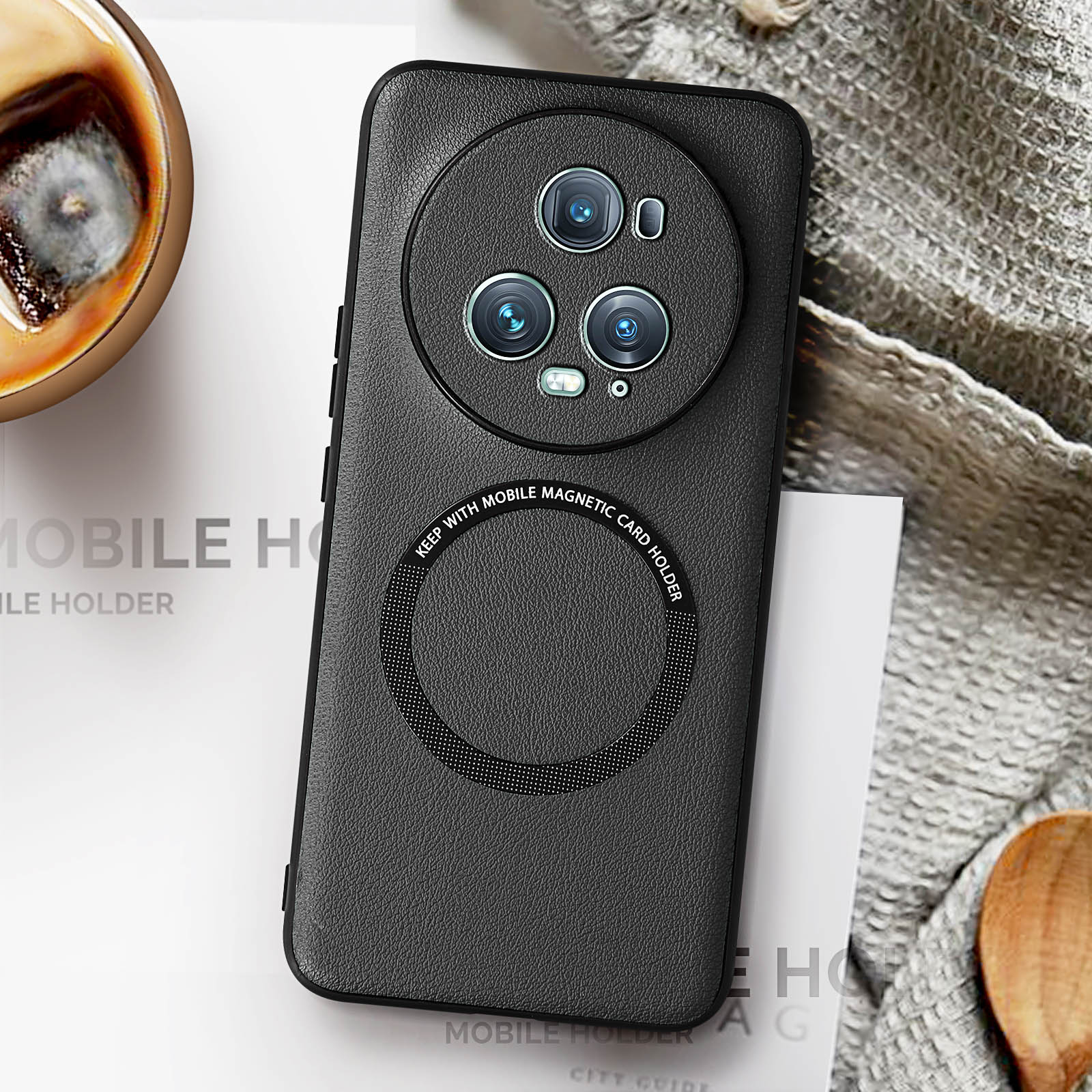 Black phone case with a circular camera bump and magnetic card holder, on a white surface.