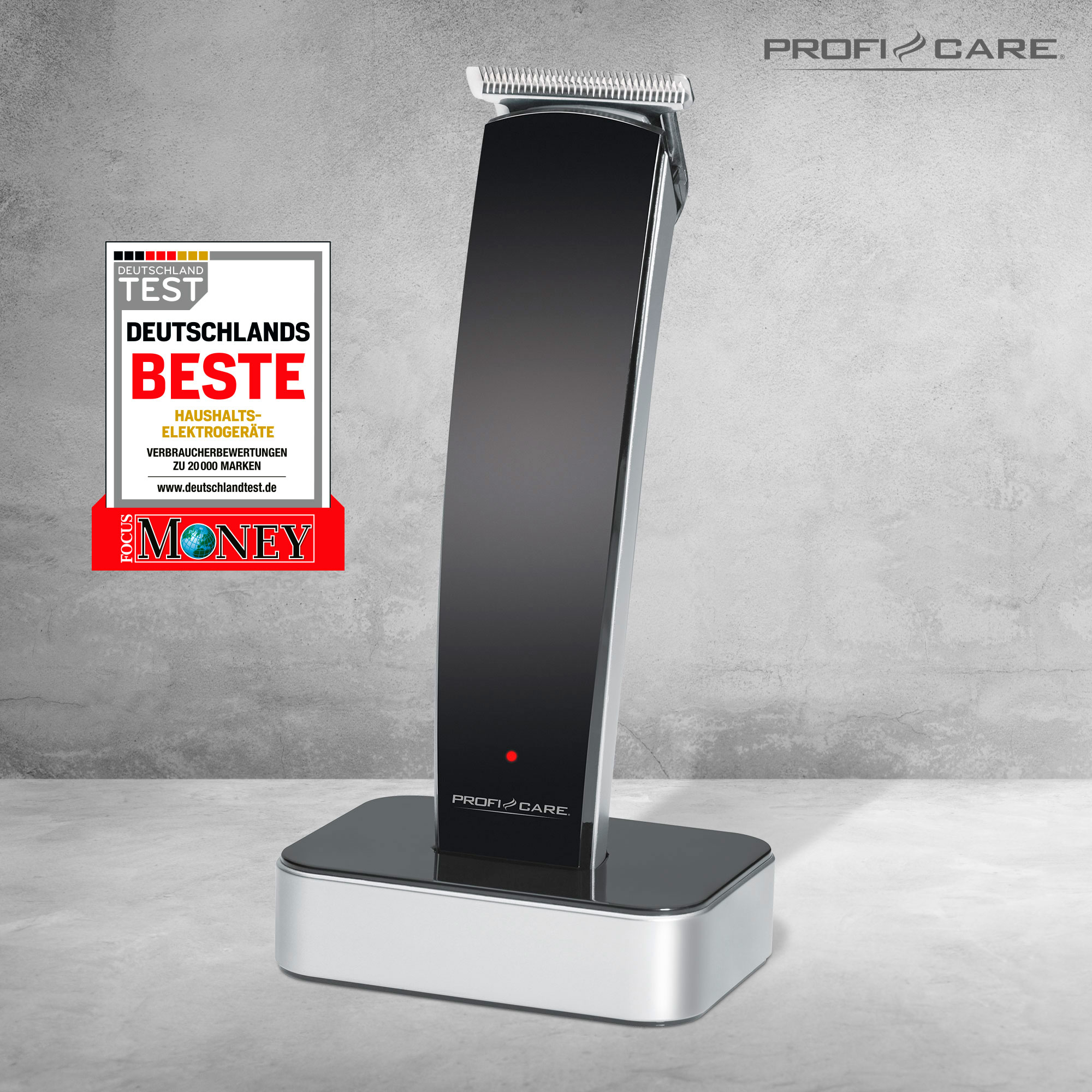 Czarna i srebrna maszynka do włosów na stojaku. Widoczne czerwone światło. Marka Profi Care.