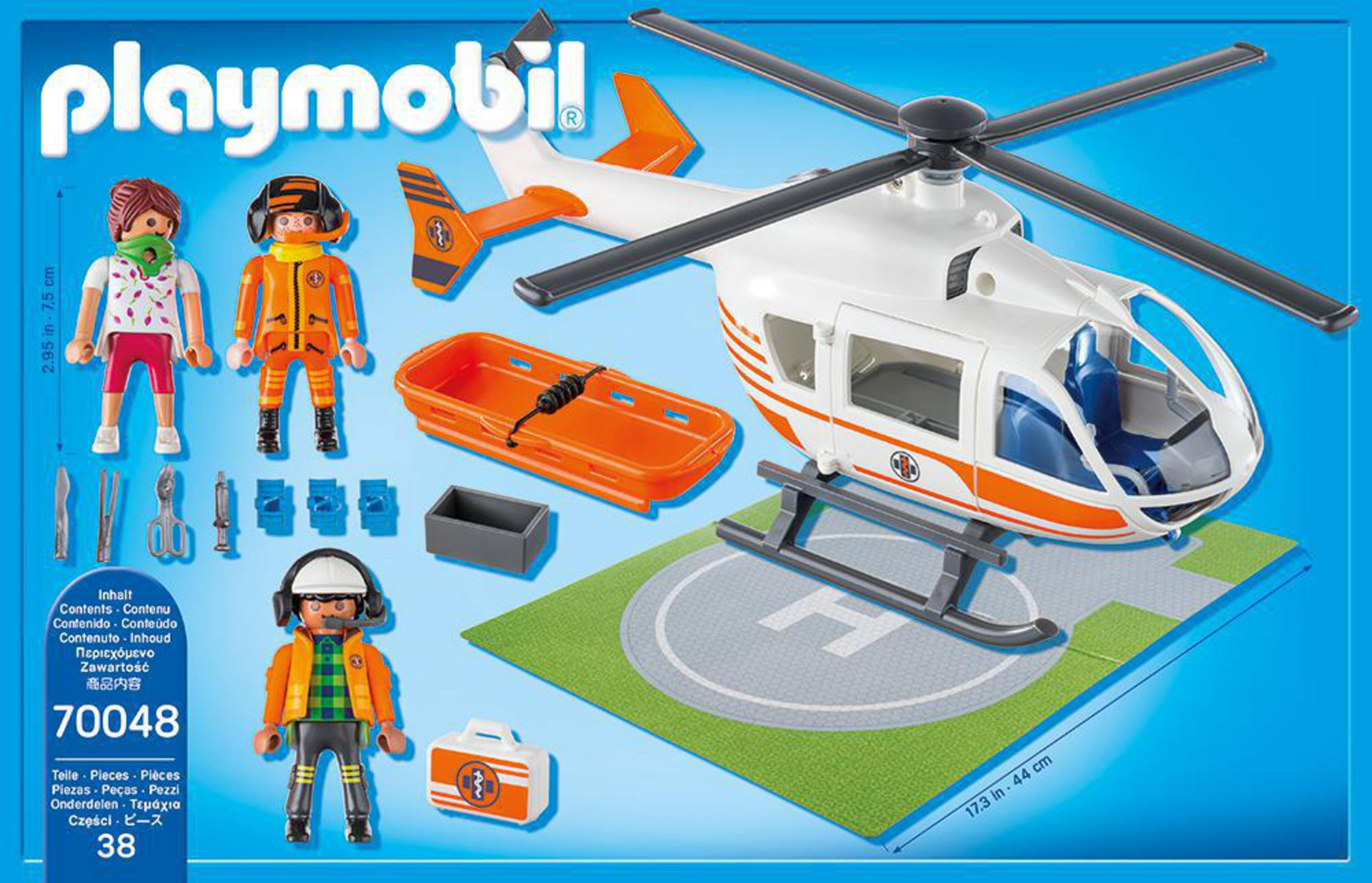 Playmobil-Rettungshubschrauber-Set mit Figuren und Zubehör, auf blauem Hintergrund.