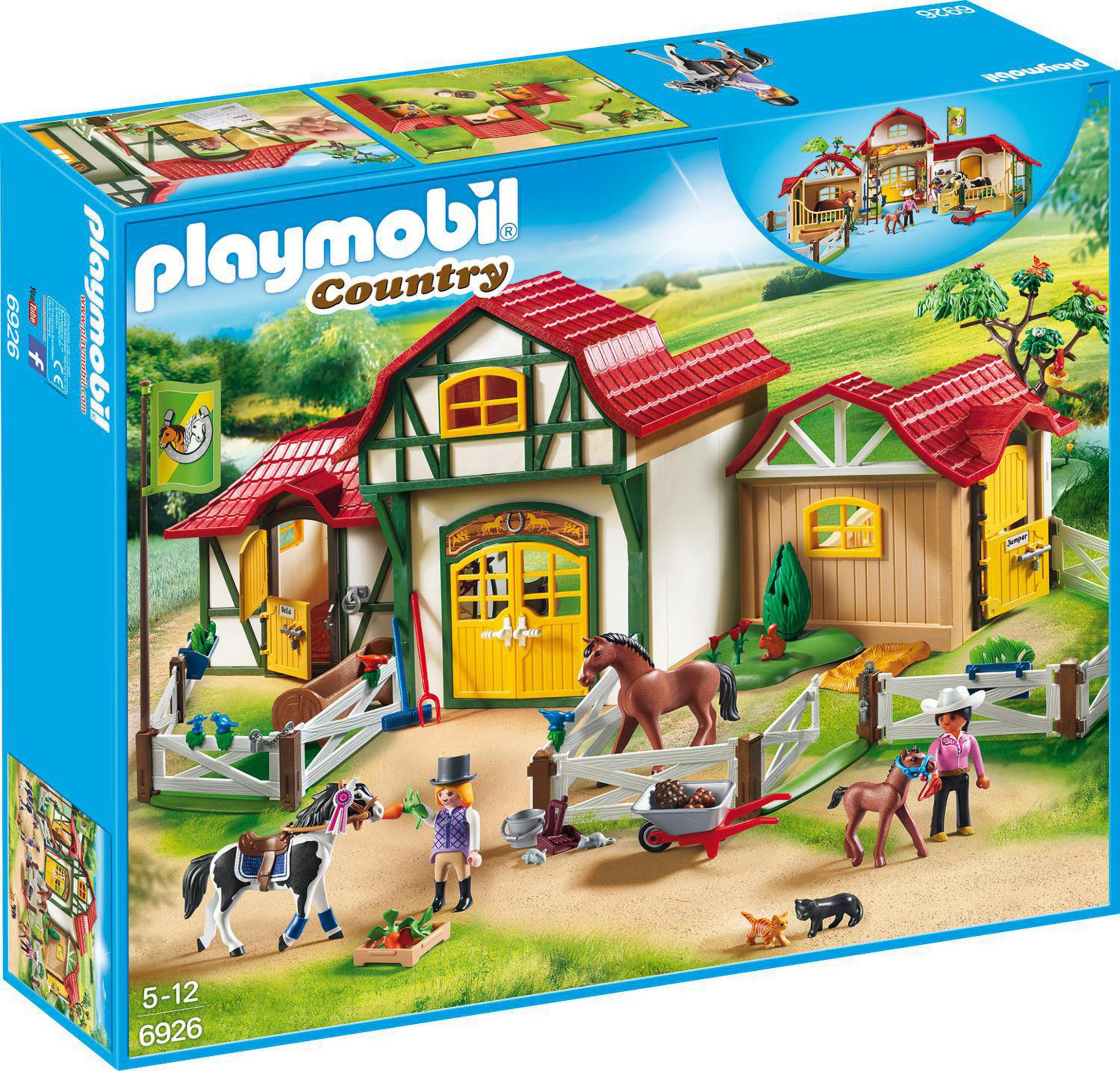 Scena z farmy Playmobil na pudełku. Ma farmę, zwierzęta i ludzi.