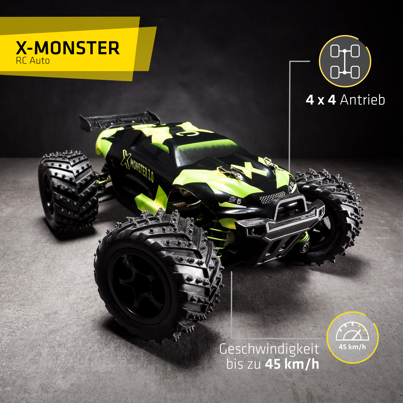 Ein schwarz-grünes ferngesteuertes Auto mit dem Text 'X-Monster'. Das Auto steht auf einer dunkelgrauen Oberfläche.
