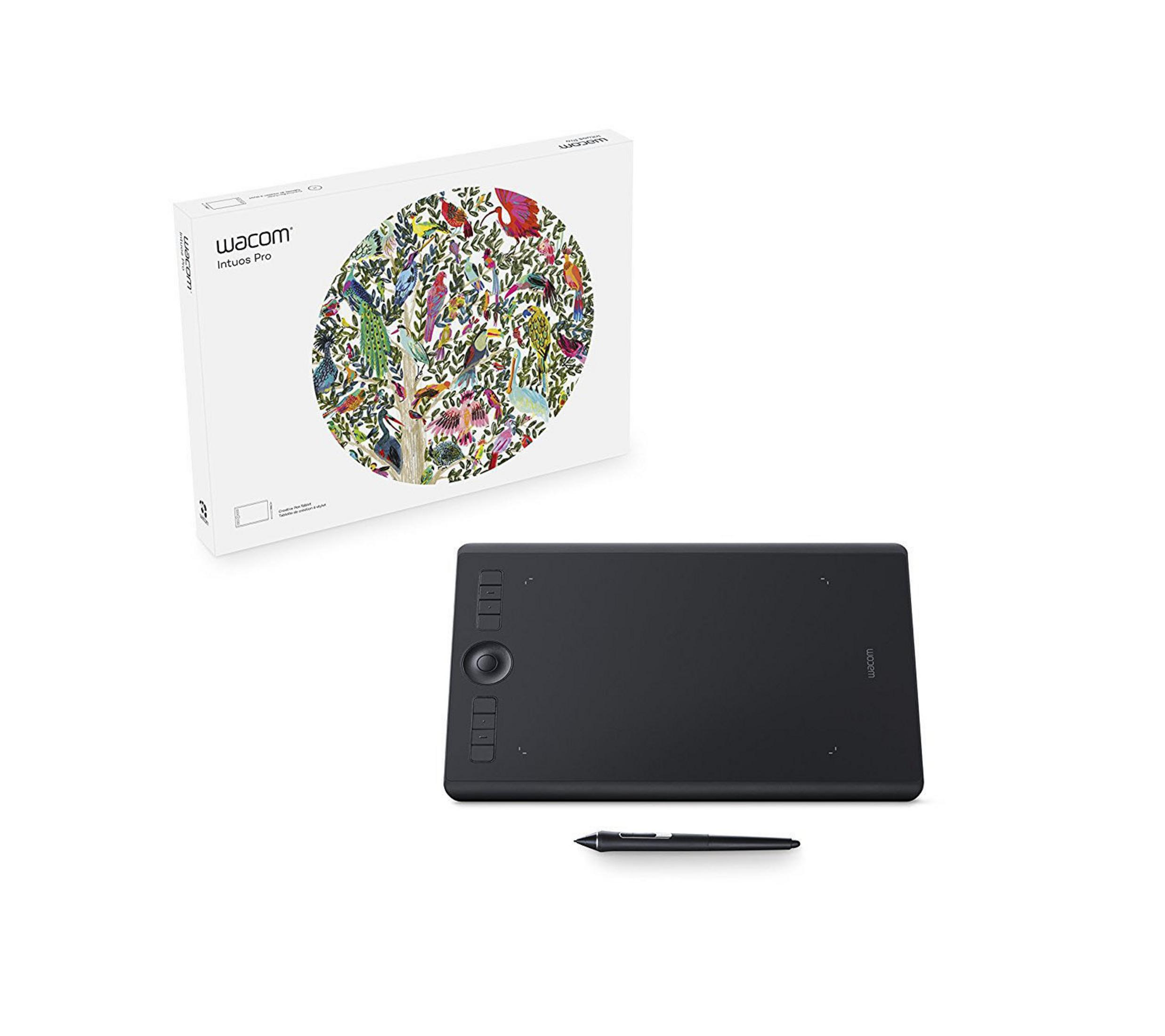 Ein schwarzes Zeichentablett, Stift und eine Box mit buntem Baum-Bild.
