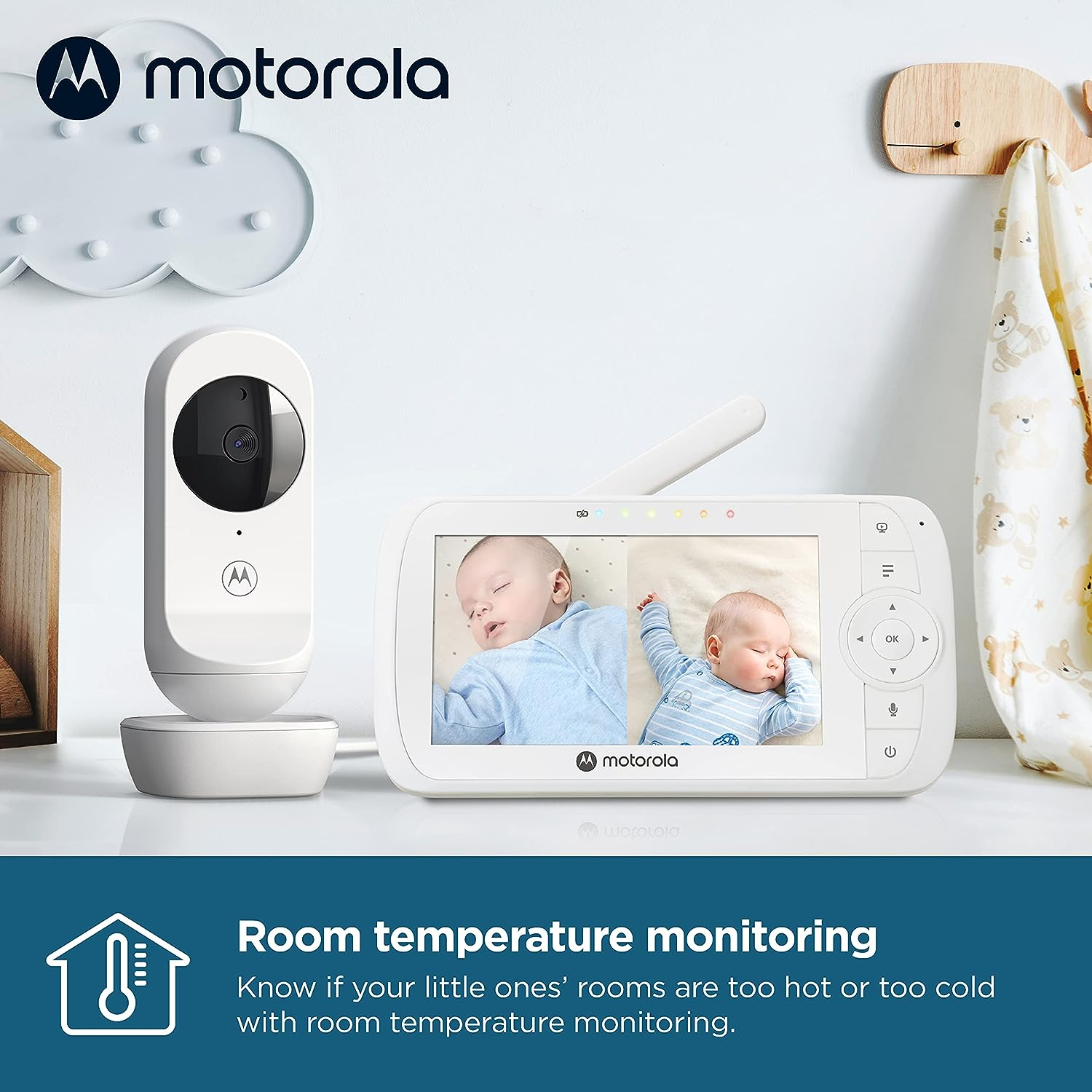 Motorola baby monitor. Screen displays two sleeping babies. Text says room temperature monitoring.