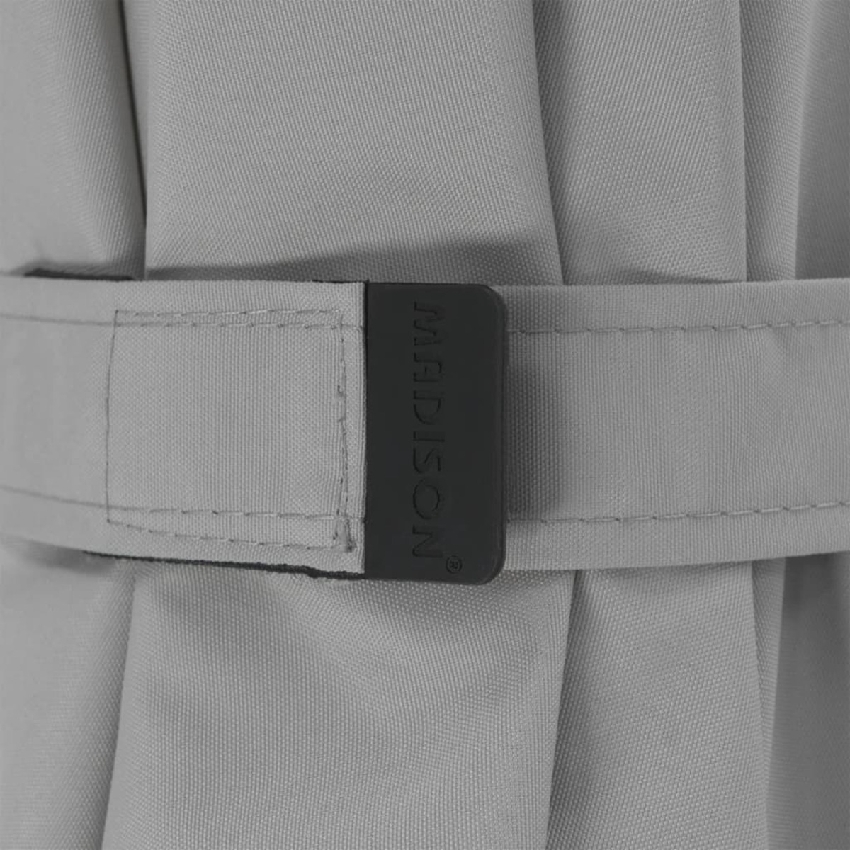 Gray umbrella strap with 'MADISON' label.