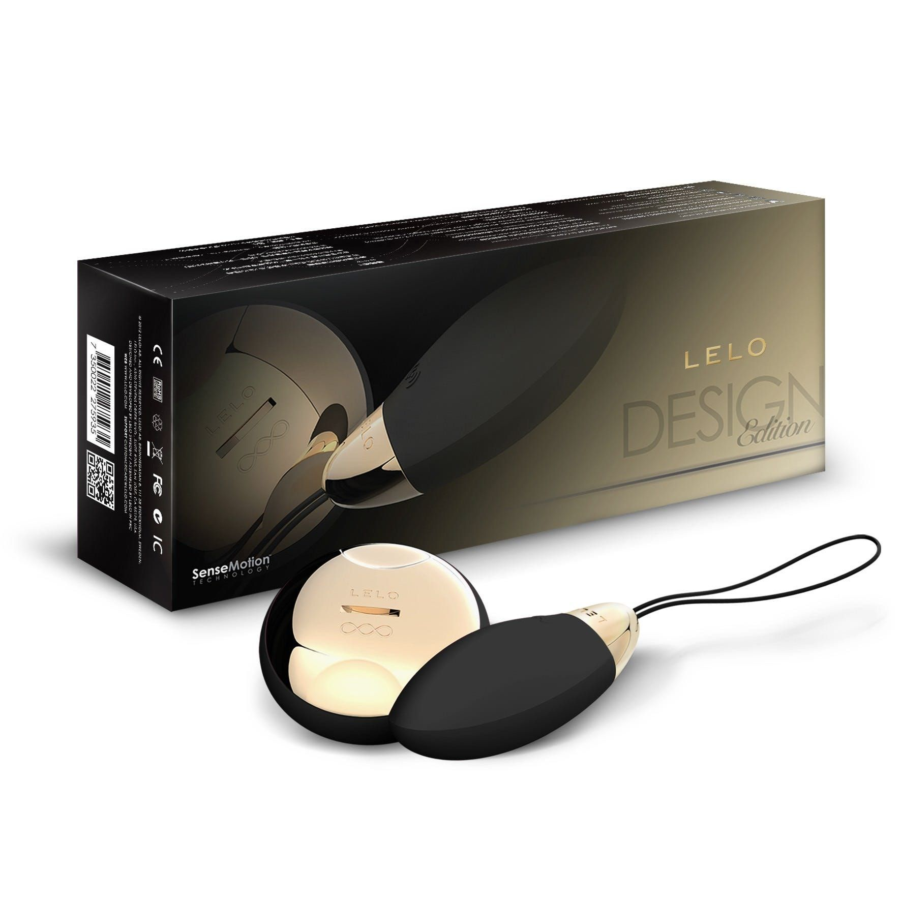 Un juguete sexual LELO Design Edition negro y dorado con su caja. El fondo es blanco.