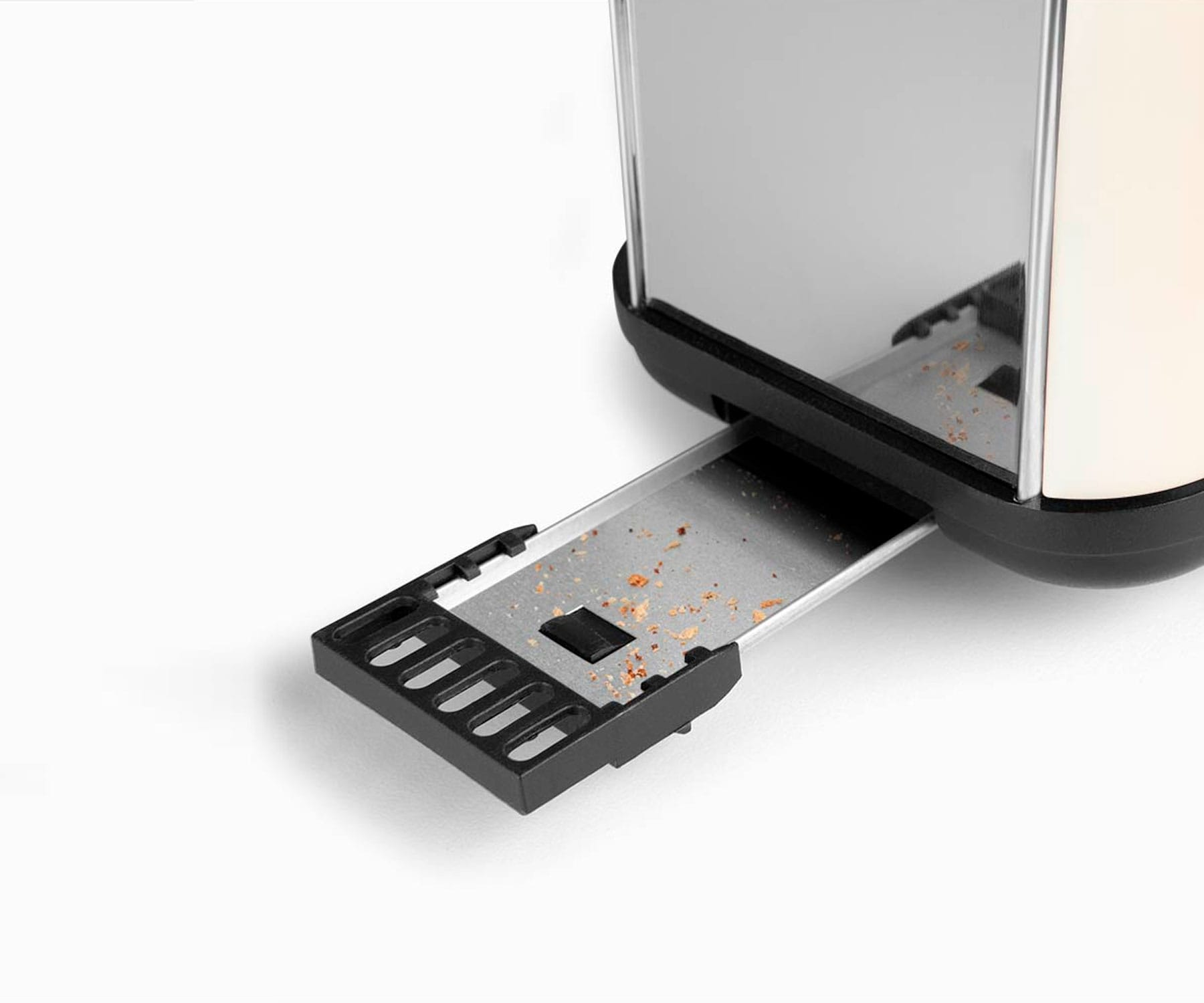 Toster z otwartą szufladą na okruchy. Zewnętrzna część jest kremowa i chromowana.