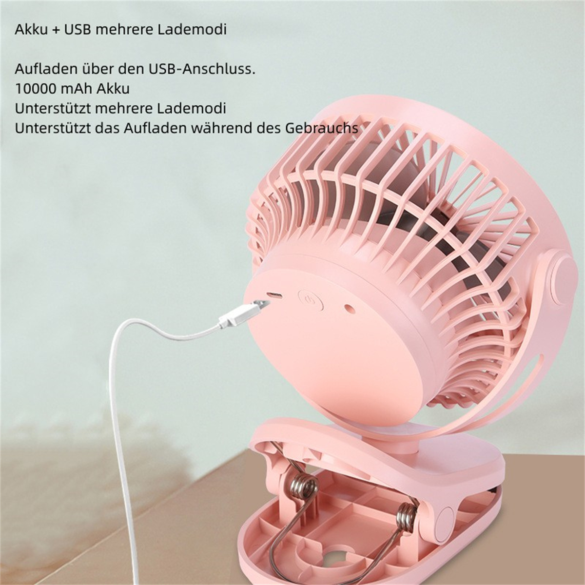 Ventilador portátil rosa con clip. Tiene puerto de carga y texto sobre duración de batería.