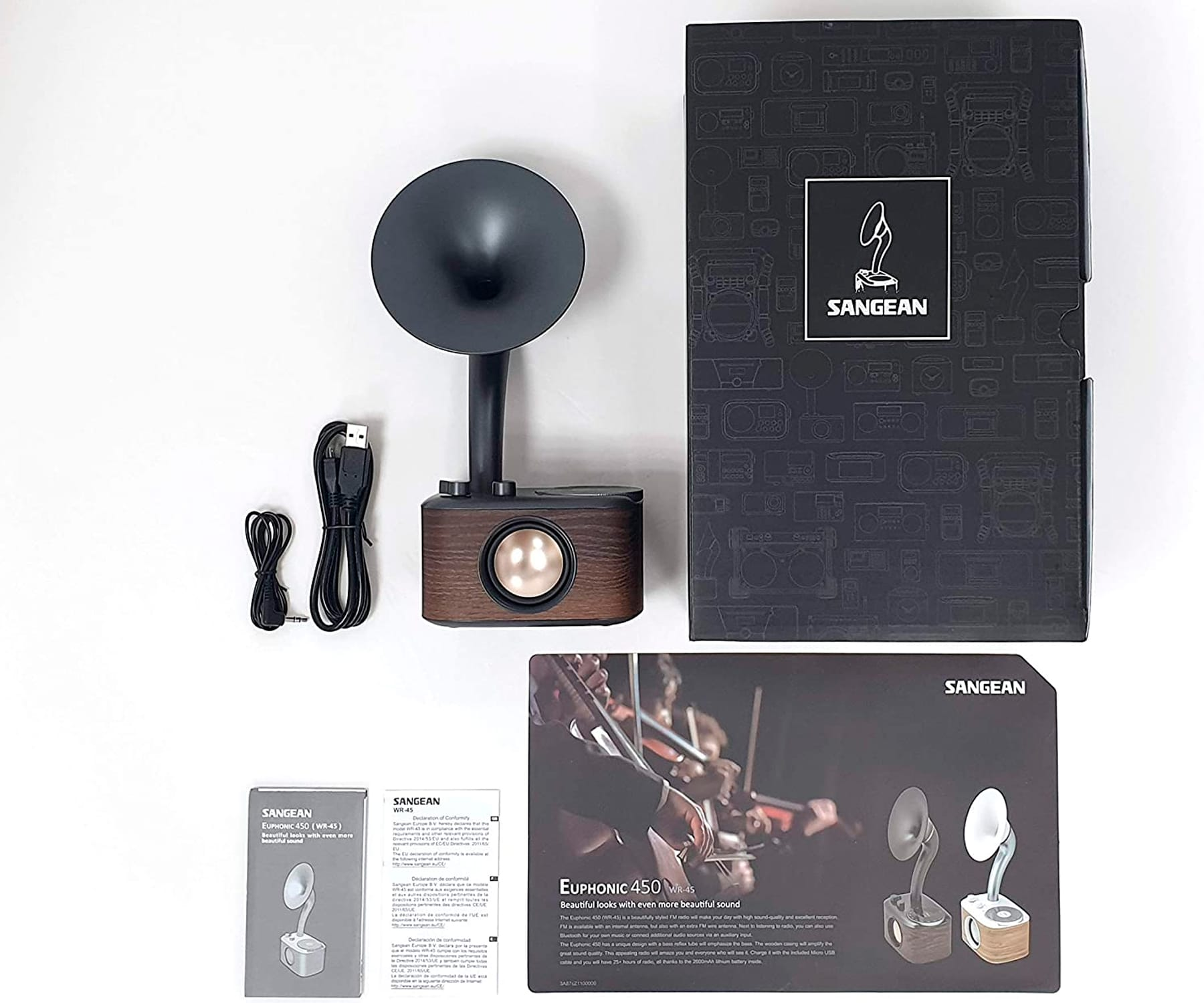Un altavoz de estilo vintage y accesorios. Incluye un altavoz, un cable USB y embalaje.