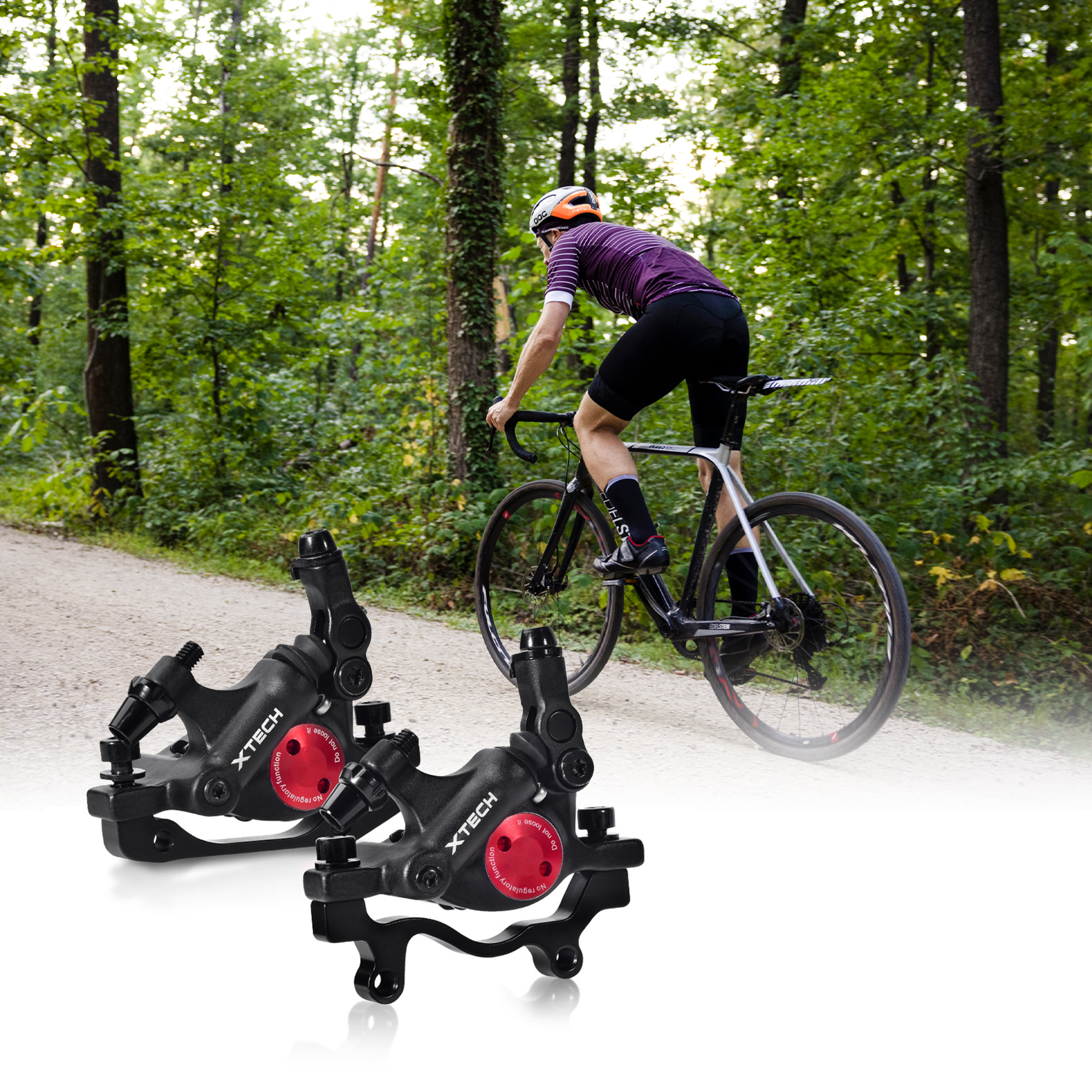 Zwei schwarze Fahrradbremssättel mit roten Akzenten. Ein Radfahrer fährt im Hintergrund.