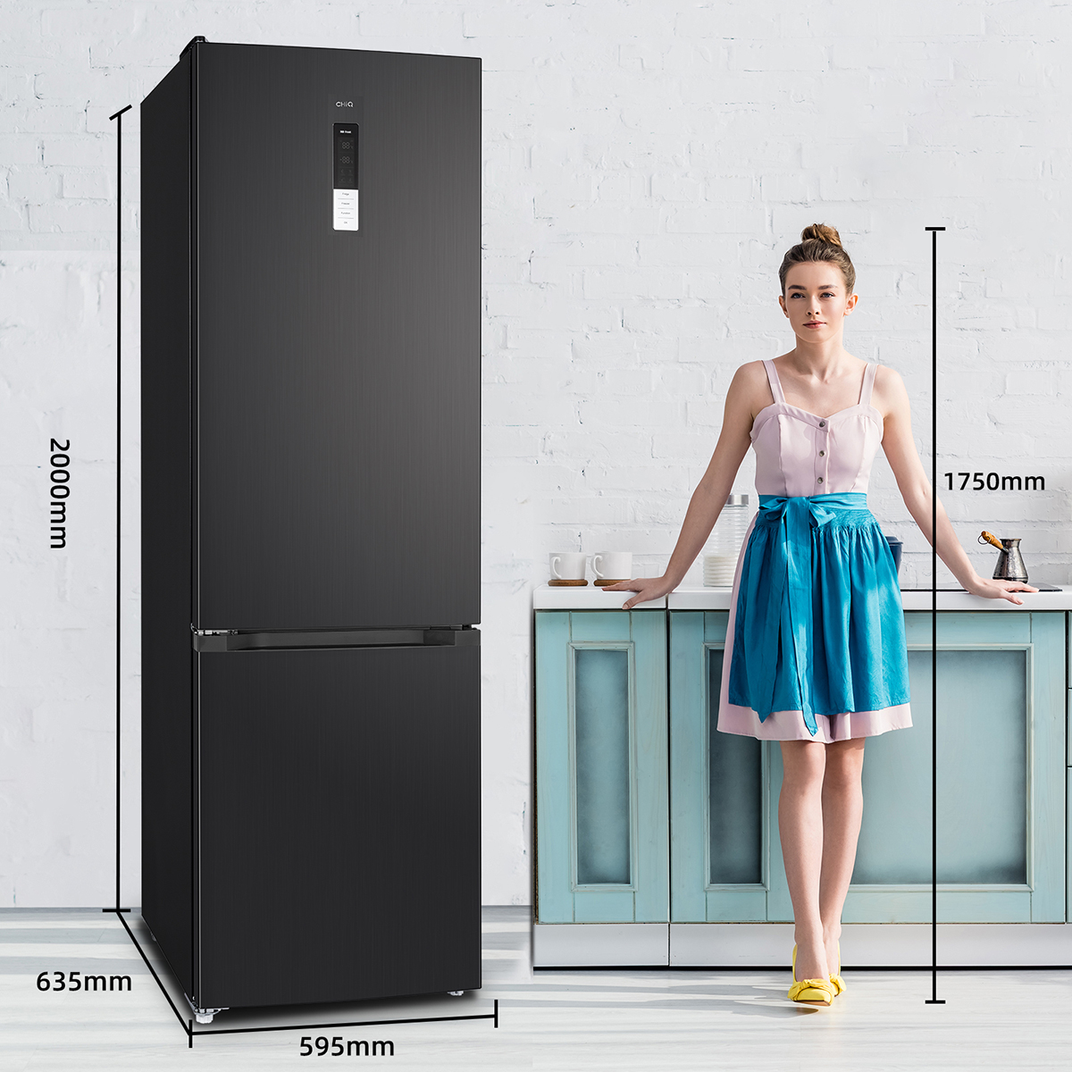 Black refrigerator next to woman. Dimensions in mm. White brick wall and blue cabinet.