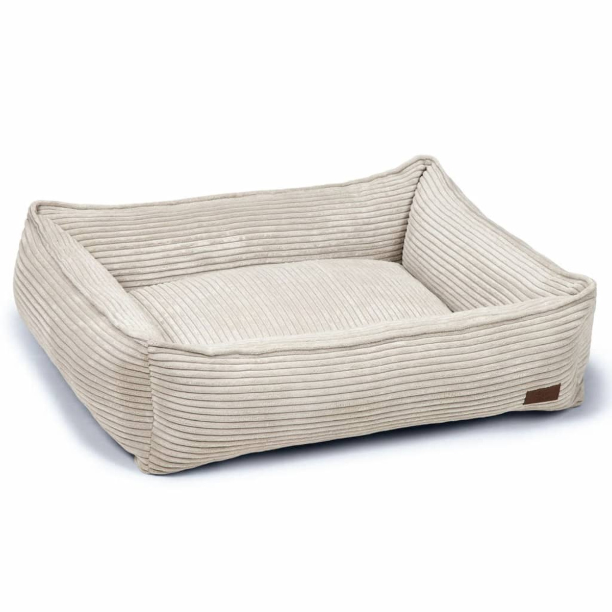 Ein hellbeige, cordartiges Hundebett mit rechteckiger Form.